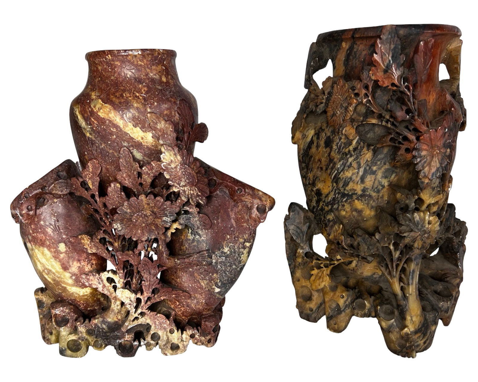 Asian Hand-Carved Soapstone Figural Vases: Pair of hand-carved Asian soapstone decorative vases featuring intricate openwork carving and applied floral motifs. The vessels are sculpted from natural soapstone with rich mottled coloration