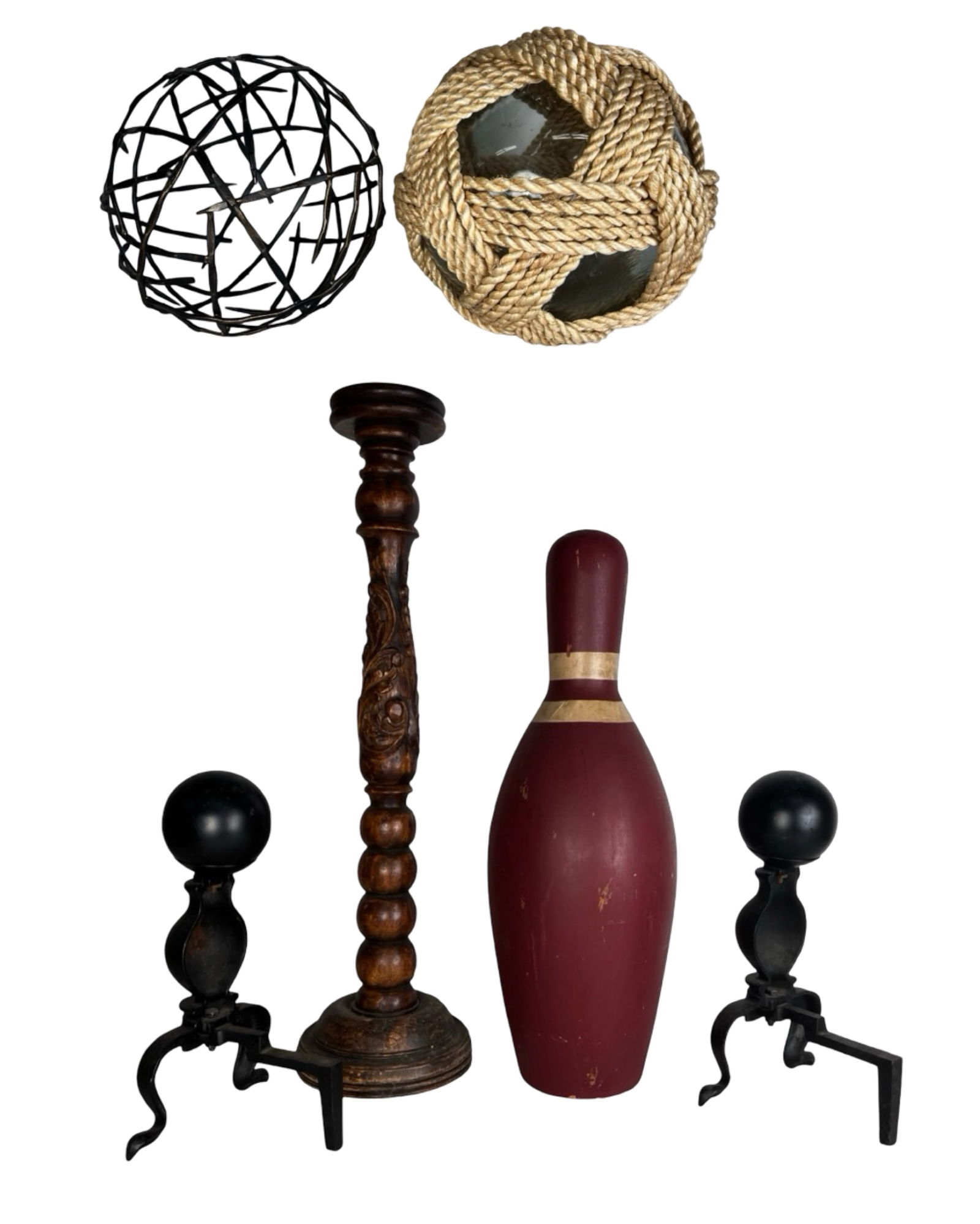 Eclectic Home Decor Assortment: Eclectic assortment of decorative home décor pieces including a coastal Nantucket-style nautical clear glass float orb wrapped in rope, a contemporary spherical metal sculpture, a turned wooden