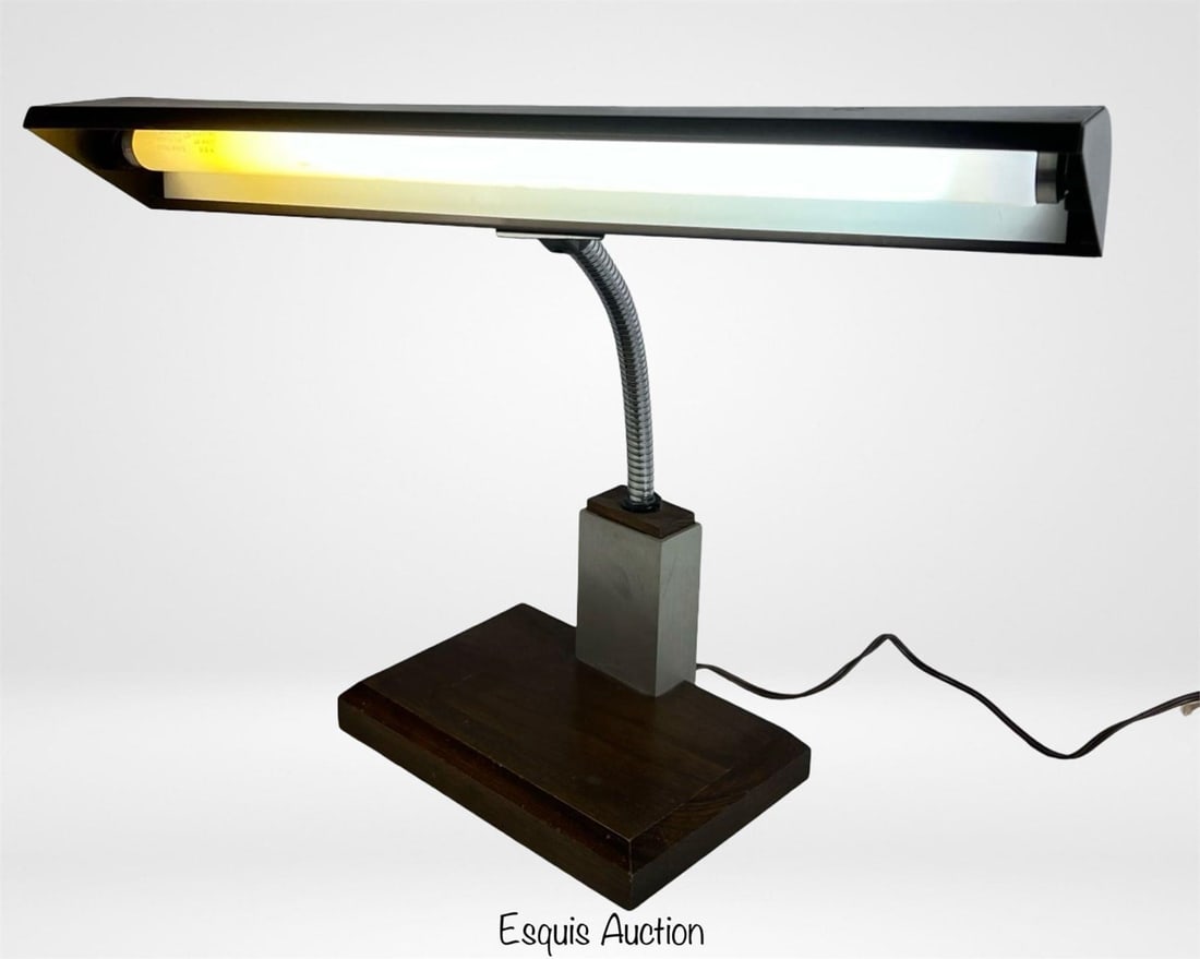 Mid-Century Modern Industrial Gooseneck Desk Lamp: Sleek 1950s industrial gooseneck desk lamp featuring a dark brown metal hood, brushed steel neck base, and a wood platform. Flexible arm allows for directional lighting, extending up to 18" high. A st