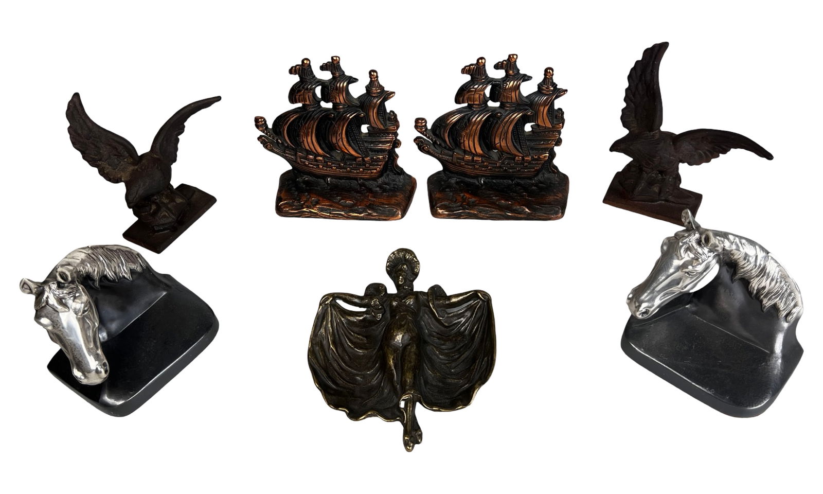 Group of Decorative Bookends & Figural Bronze Dish: Assorted collection of decorative metal bookends and a figural bronze dish featuring nautical, animal, and Art Nouveau inspired designs. The group includes a pair of cast iron clipper ship bookends
