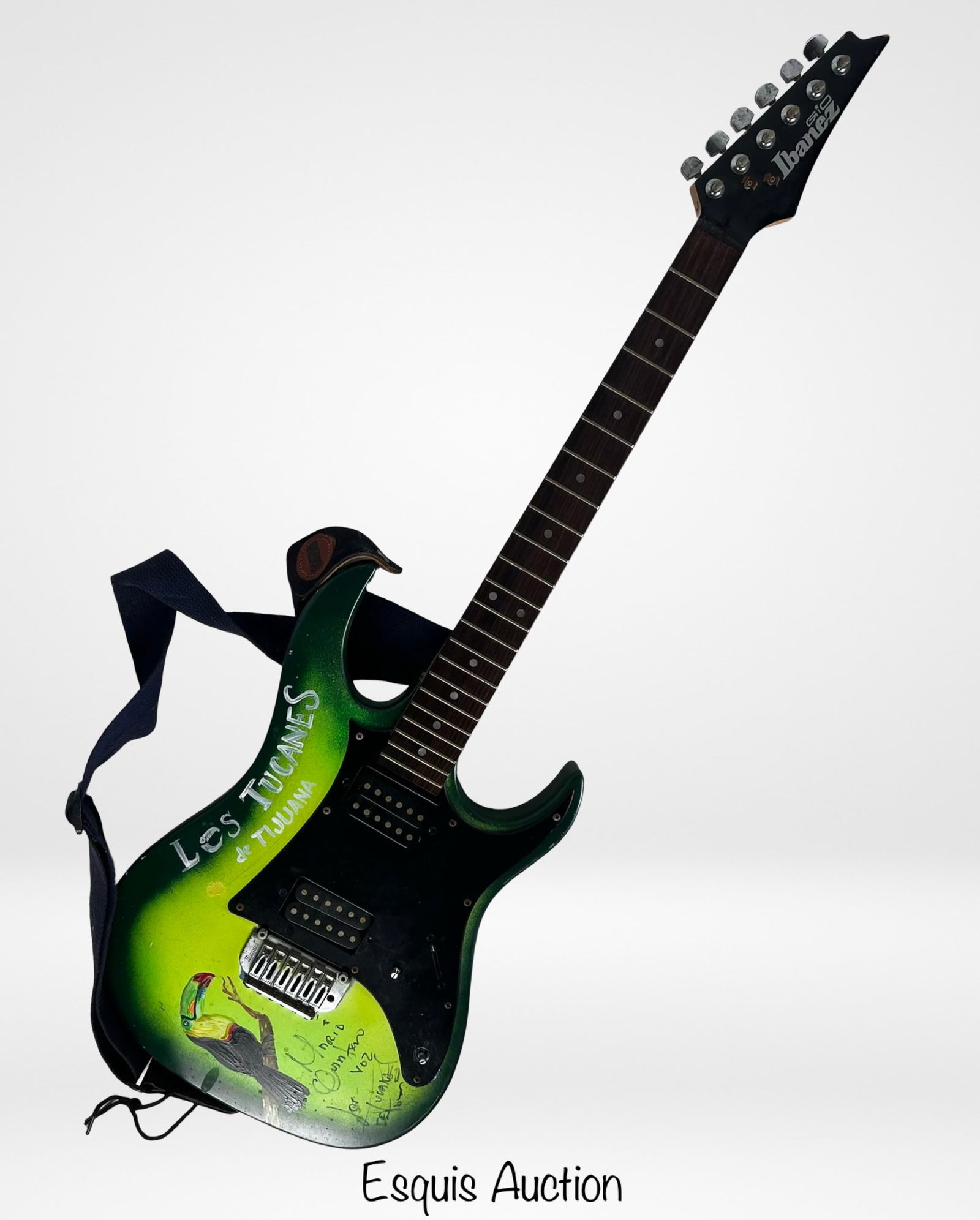 Mario Quintero Lara Los Tucanes Signed Guitar: Electric guitar signed by Mario Quintero Lara, founder, songwriter, and lead vocalist of the renowned Mexican norteño band Los Tucanes de Tijuana. The guitar features a custom green burst body with