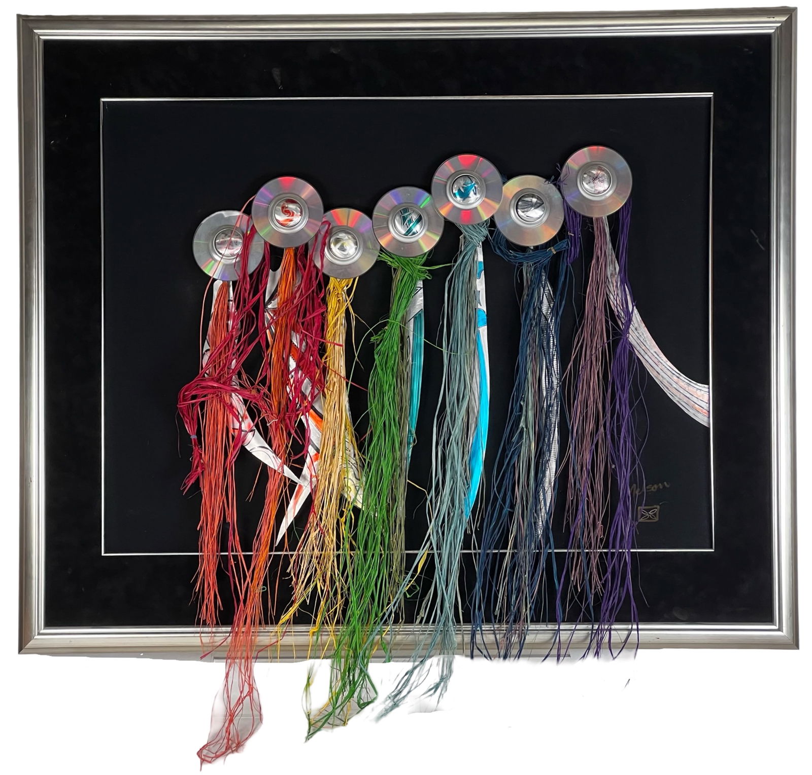 Mitchell Melson Jr. Mixed Media Wll Sculpture: Large and visually striking mixed media assemblage by Mitchell Melson Jr., incorporating compact discs, colorful fiber strands, and found materials arranged in a rhythmic, cascading composition