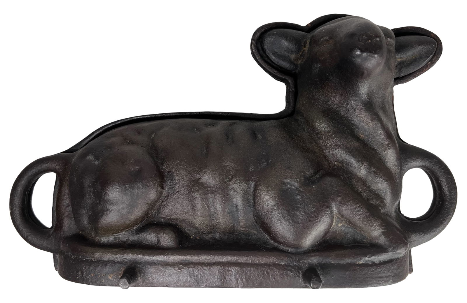 Antique Cast Iron Lamb Cake Mold: Antique cast iron lamb cake mold in a classic two-piece form, designed for baking detailed figural cakes. The mold features a recumbent lamb with well-defined body contours and textured wool, along