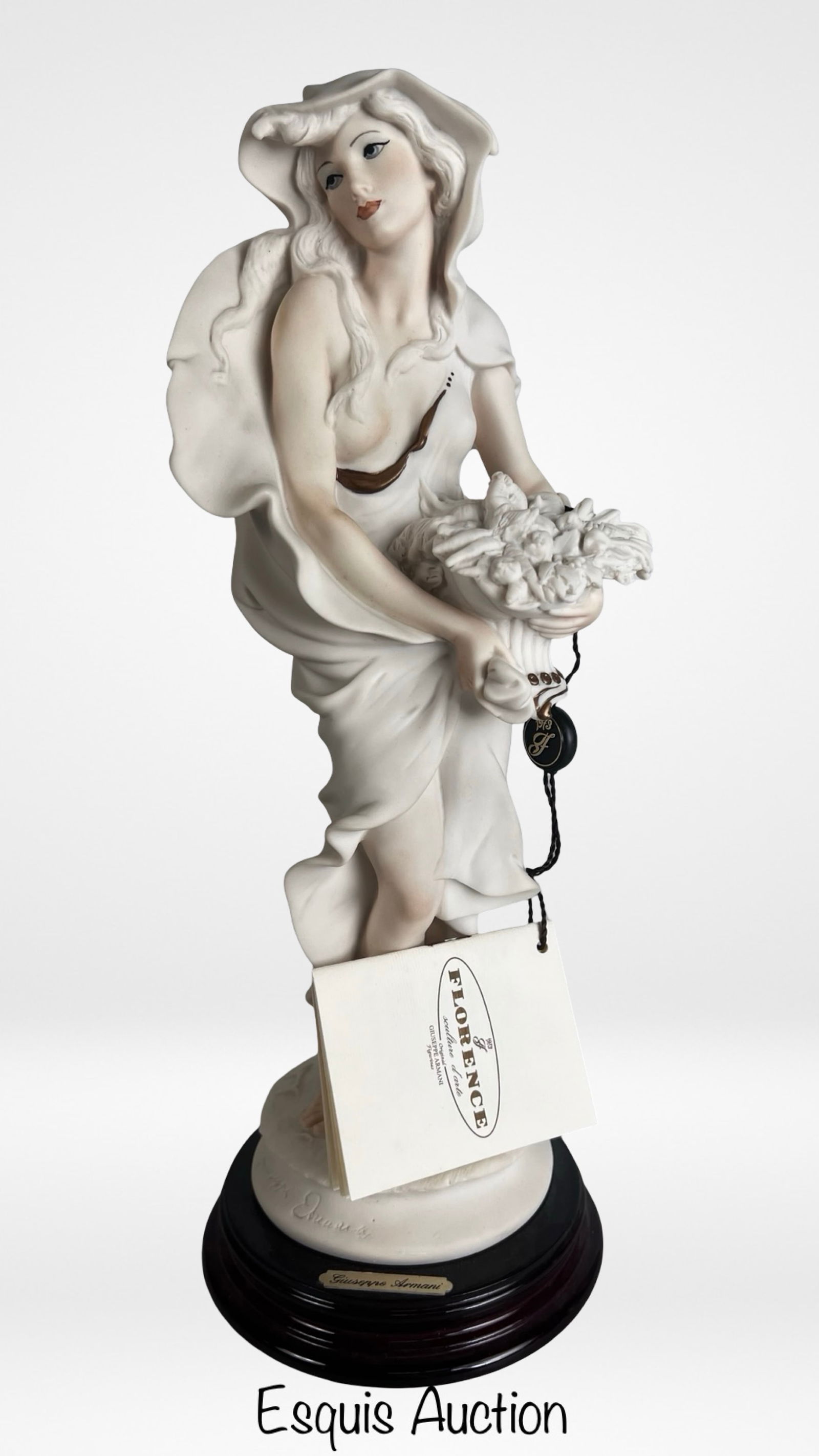 Giuseppe Armani "Winter - Lady With Cowl" Figurine: Elegant porcelain figurine titled "Winter - Lady With Cowl" designed by renowned Italian sculptor Giuseppe Armani. The sculpture depicts a graceful young woman draped in flowing garments and a hooded