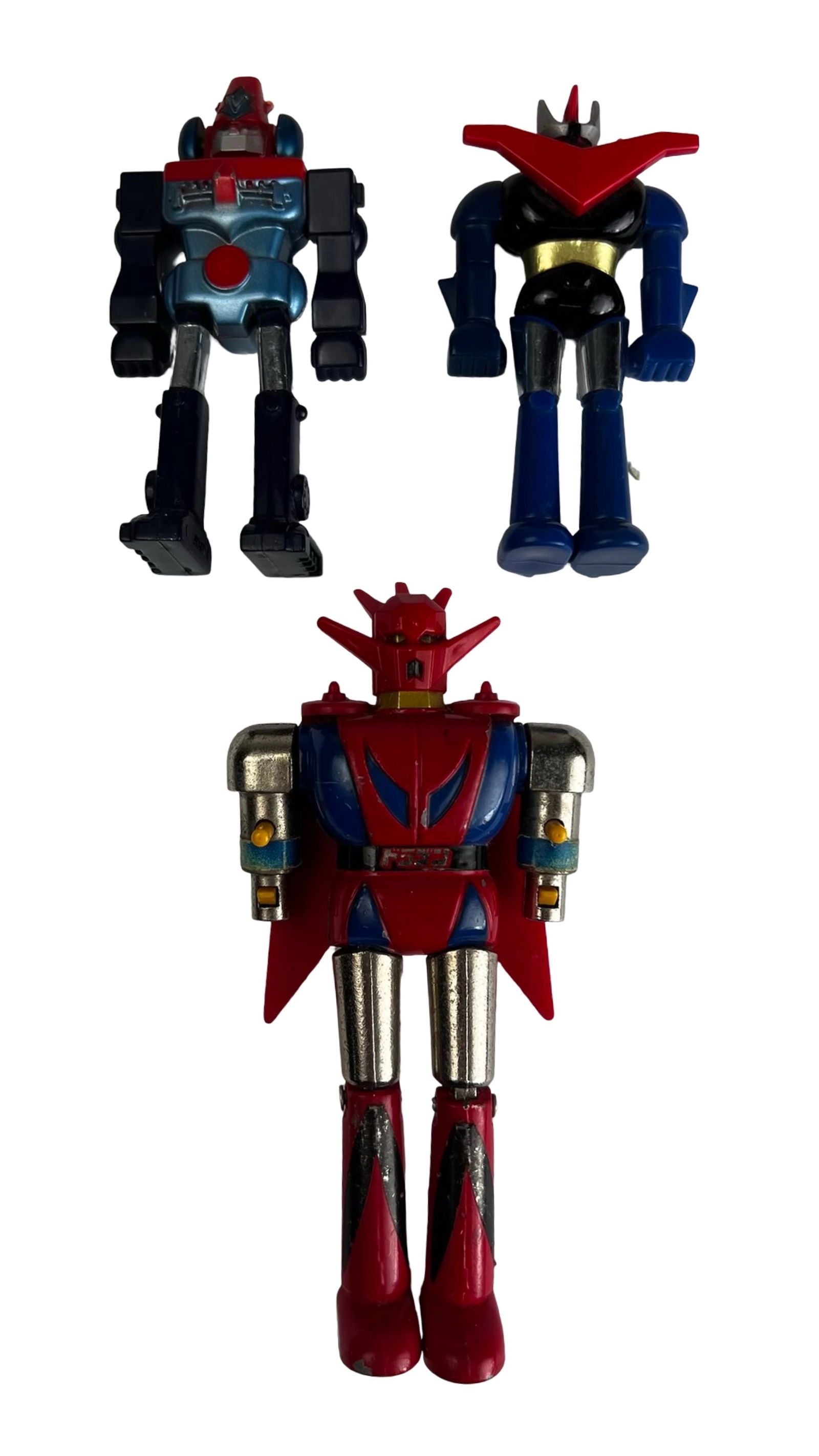 Vintage 1970s Shogun Warriors Die-Cast Robots: Lot of three vintage Shogun Warriors-style robot figures produced during the 1970s era of Japanese super robot toys. The group includes a Popy Chogokin Dragun die-cast metal robot, a Bandai Mazinga