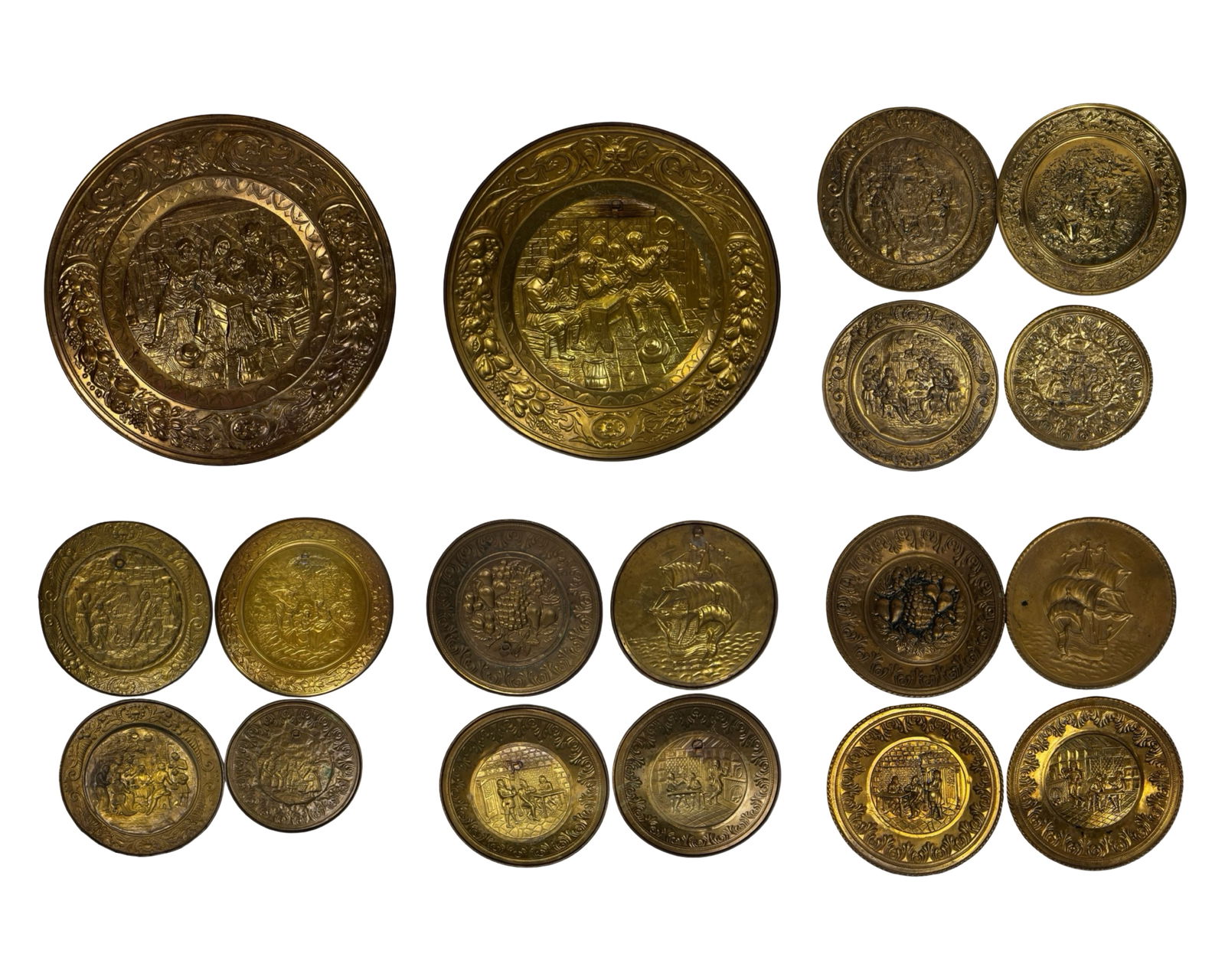 Vintage Brass Repousse Wall Plates & Chargers: Impressive collection of vintage brass repousse wall hanging plates and chargers featuring richly detailed figural and decorative scenes. The group includes tavern interiors, musicians, courting