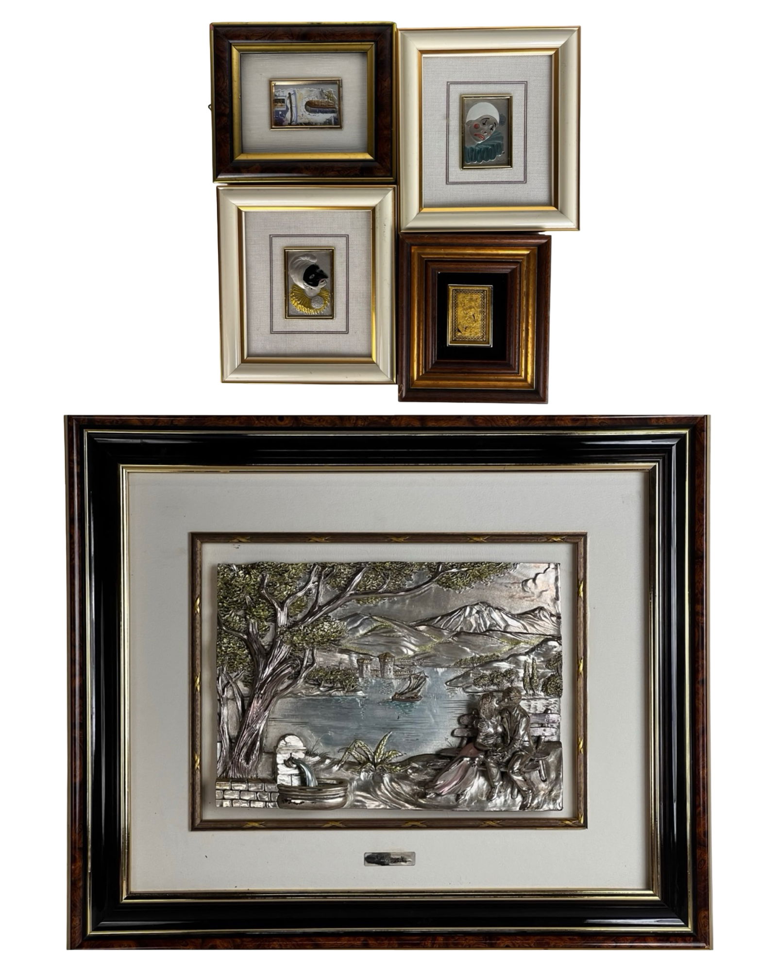 Italian Sterling Silver Bas Relief Framed Art: Decorative group of five Italian sterling silver laminate ("laminato argento") relief plaques, including a larger landscape scene titled "Paessagio" and four smaller figural compositions. The main