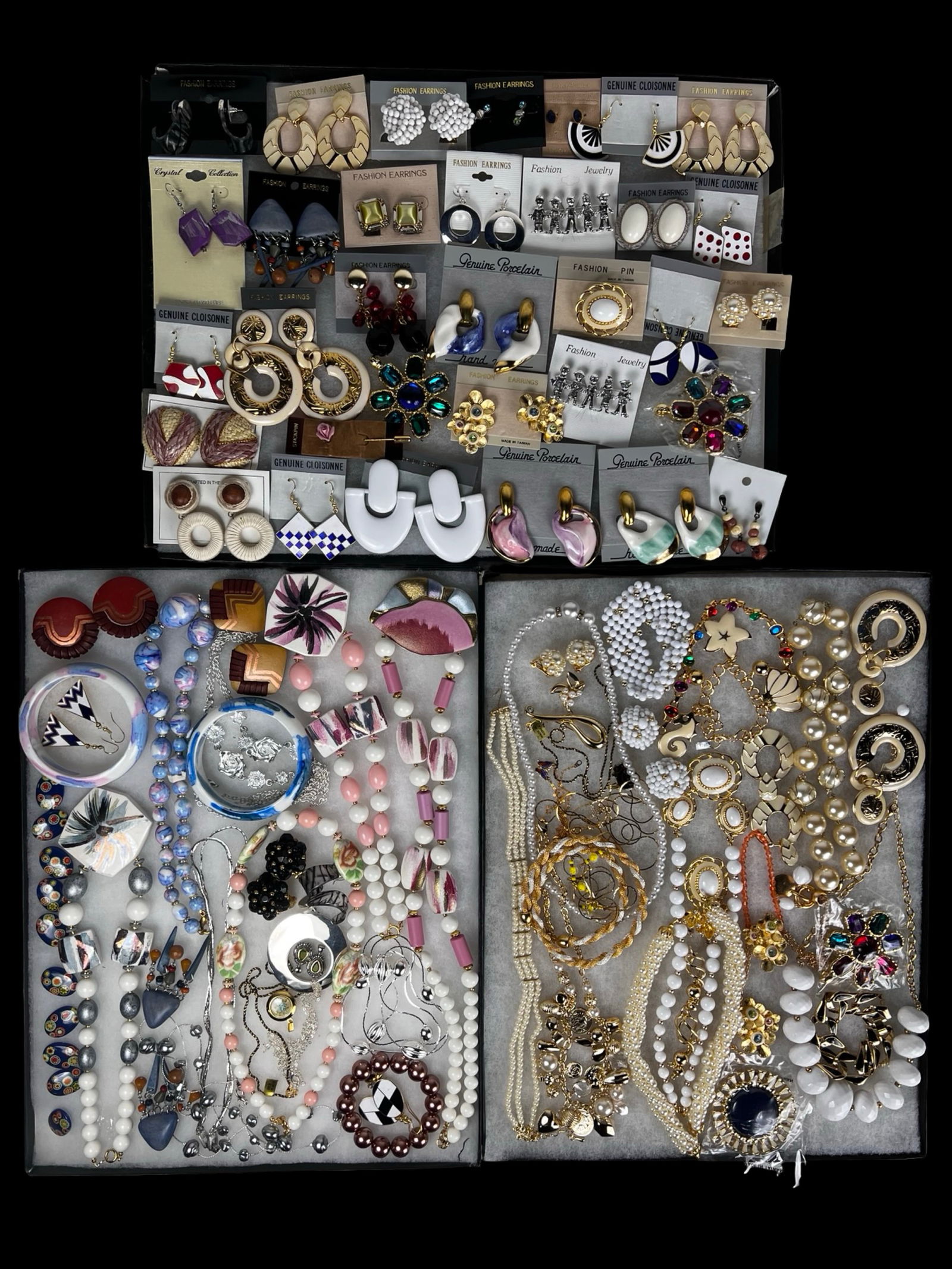 Colorful & Sparkling Assortment of Costume Jewelry: A colorful and sparkling assortment of costume jewelry featuring a mix of necklaces, earrings, bracelets, and other stylish accessories. This diverse grouping offers plenty of shine and versatility,