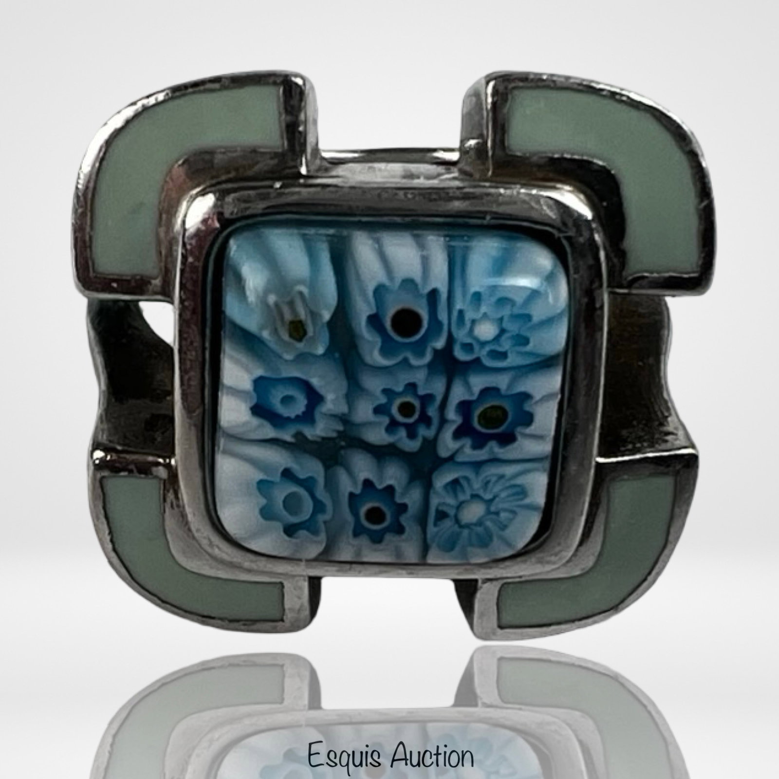 Sterling Silver Murano Millefiori Art Glass Ring: Distinctive sterling silver ring featuring a vibrant Murano millefiori art glass centerpiece with intricate blue floral cane patterns. The square cabochon displays layered glasswork typical of