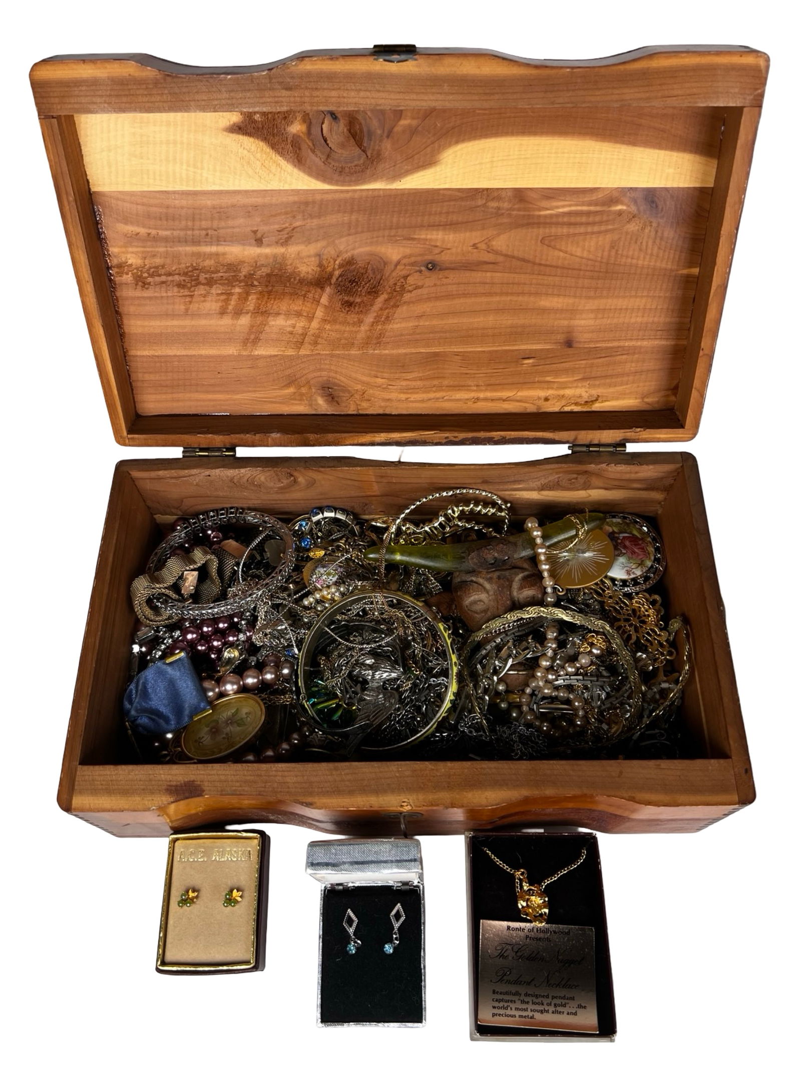 Box filled with Vintage Unsearched Costume Jewelry: Dive into a delightful assortment of vintage unsearched costume and craft jewelry, filled with character and creative potential. This abundant lot features a diverse blend of styles, hues, and