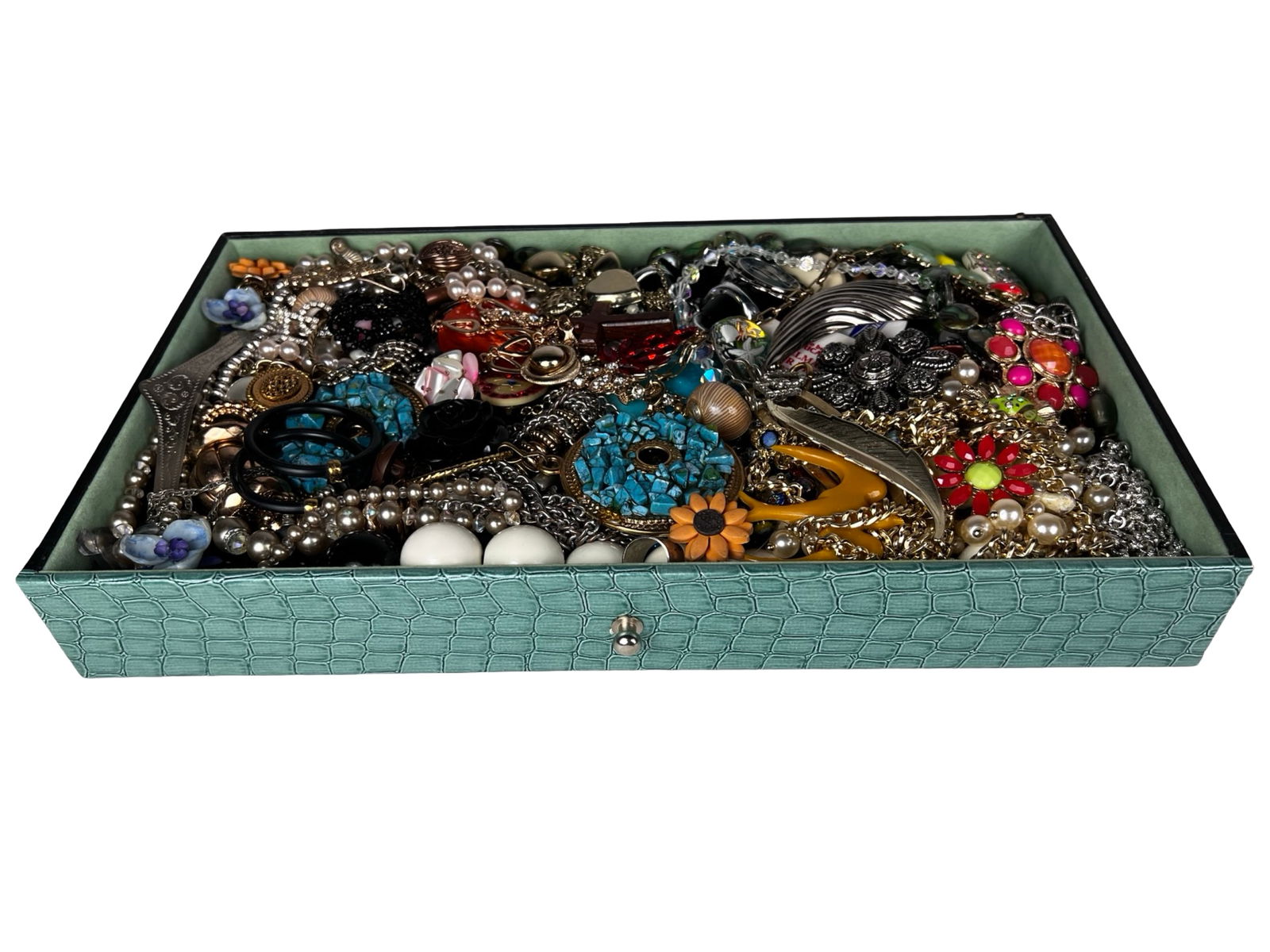Box filled with Vintage Unsearched Costume Jewelry: A charming assortment of vintage, unsearched costume and craft jewelry awaits, filled with creative potential and nostalgic appeal. The collection offers a wide variety of styles, colors, and