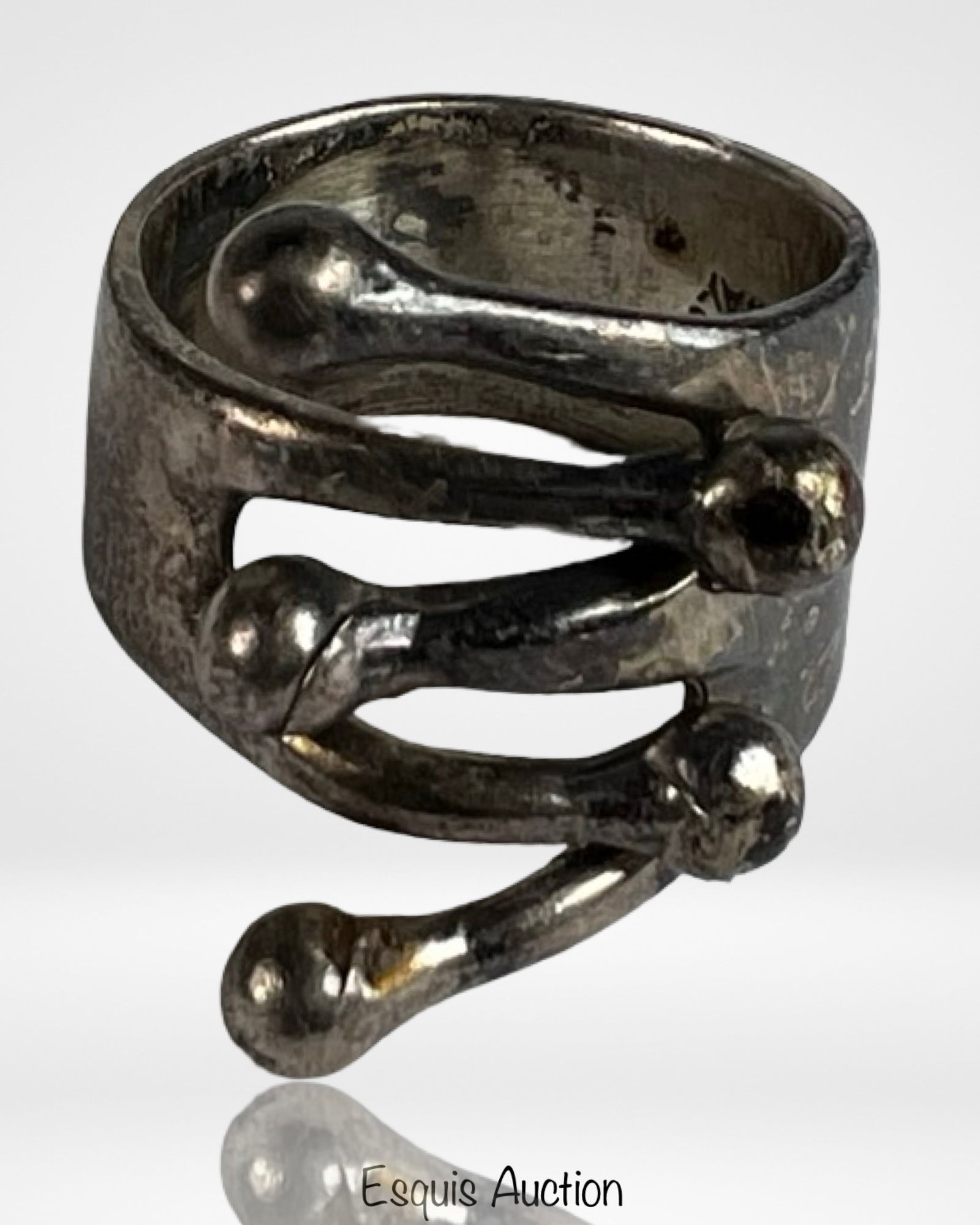 Anna Greta Eker Sterling Modernist Jester Ring: Distinctive vintage modernist ring by Norwegian designer Anna Greta Eker, marked AGE Sterling Norway. The sculptural form features an abstract jester inspired design with fluid, looping silver
