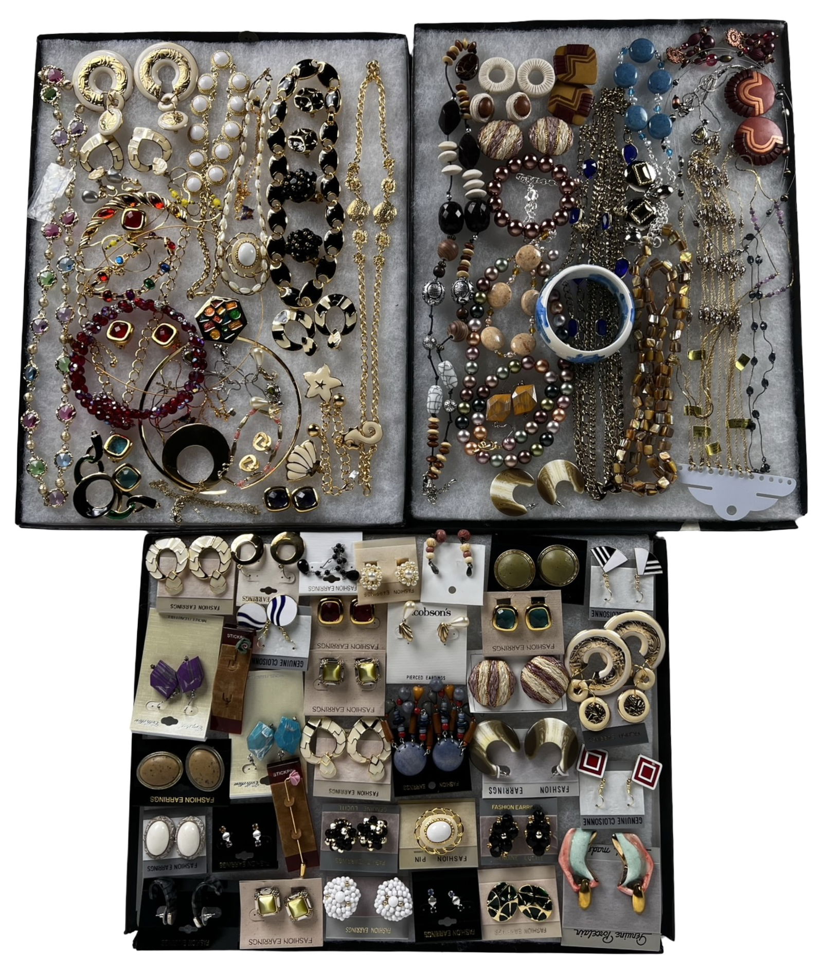 Colorful & Sparkling Assortment of Costume Jewelry: A colorful and sparkling assortment of costume jewelry featuring a mix of necklaces, earrings, bracelets, and other stylish accessories. This diverse grouping offers plenty of shine and versatility,