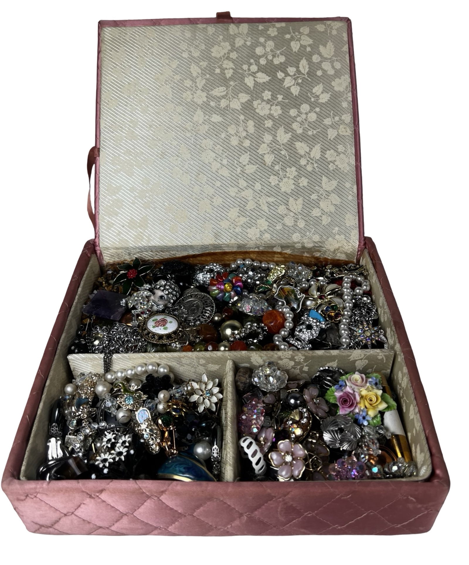 Box filled with Vintage Unsearched Costume Jewelry: A charming assortment of vintage, unsearched costume and craft jewelry awaits, filled with creative potential and nostalgic appeal. The collection offers a wide variety of styles, colors, and