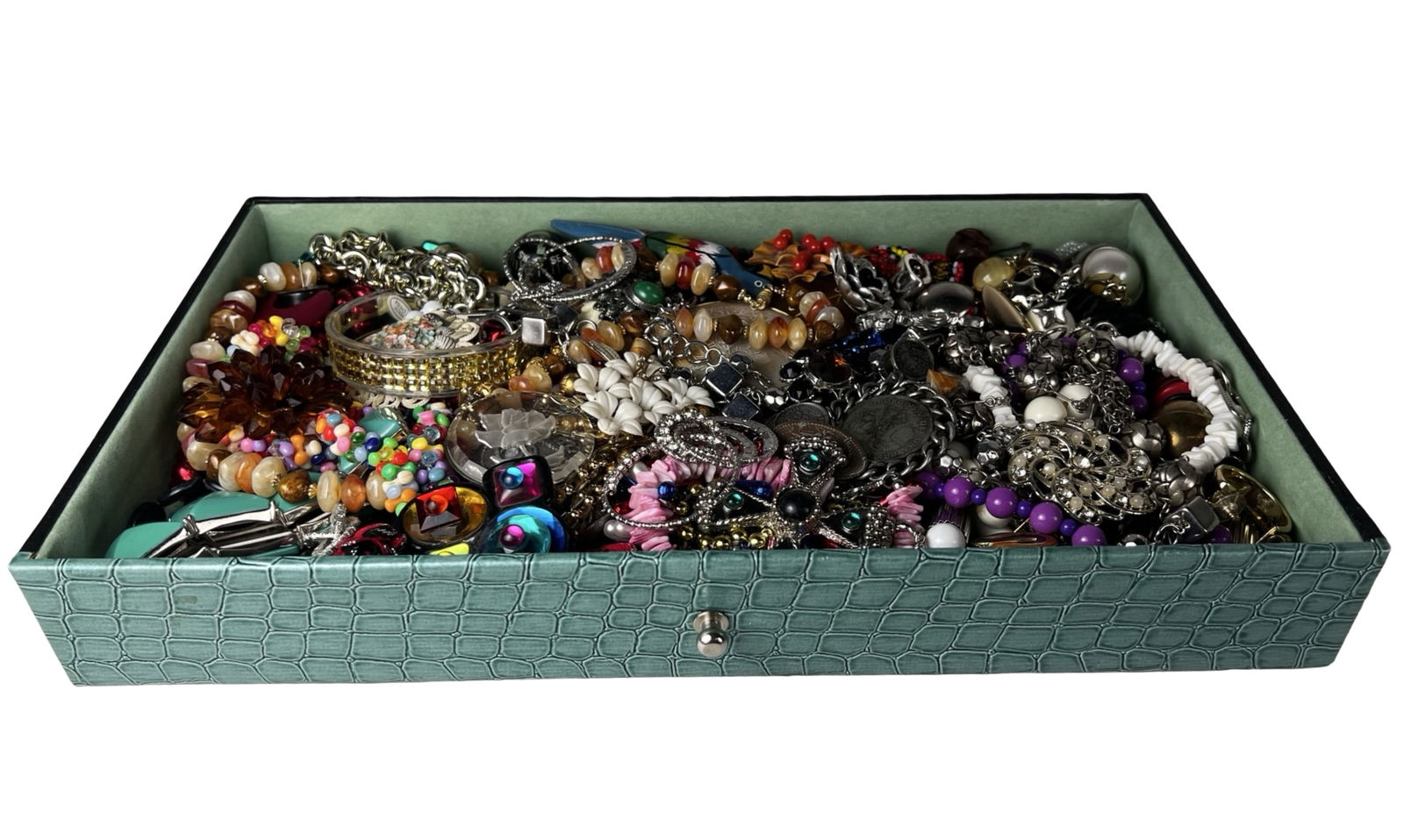 Box filled with Vintage Unsearched Costume Jewelry: A charming assortment of vintage, unsearched costume and craft jewelry awaits, filled with creative potential and nostalgic appeal. The collection offers a wide variety of styles, colors, and