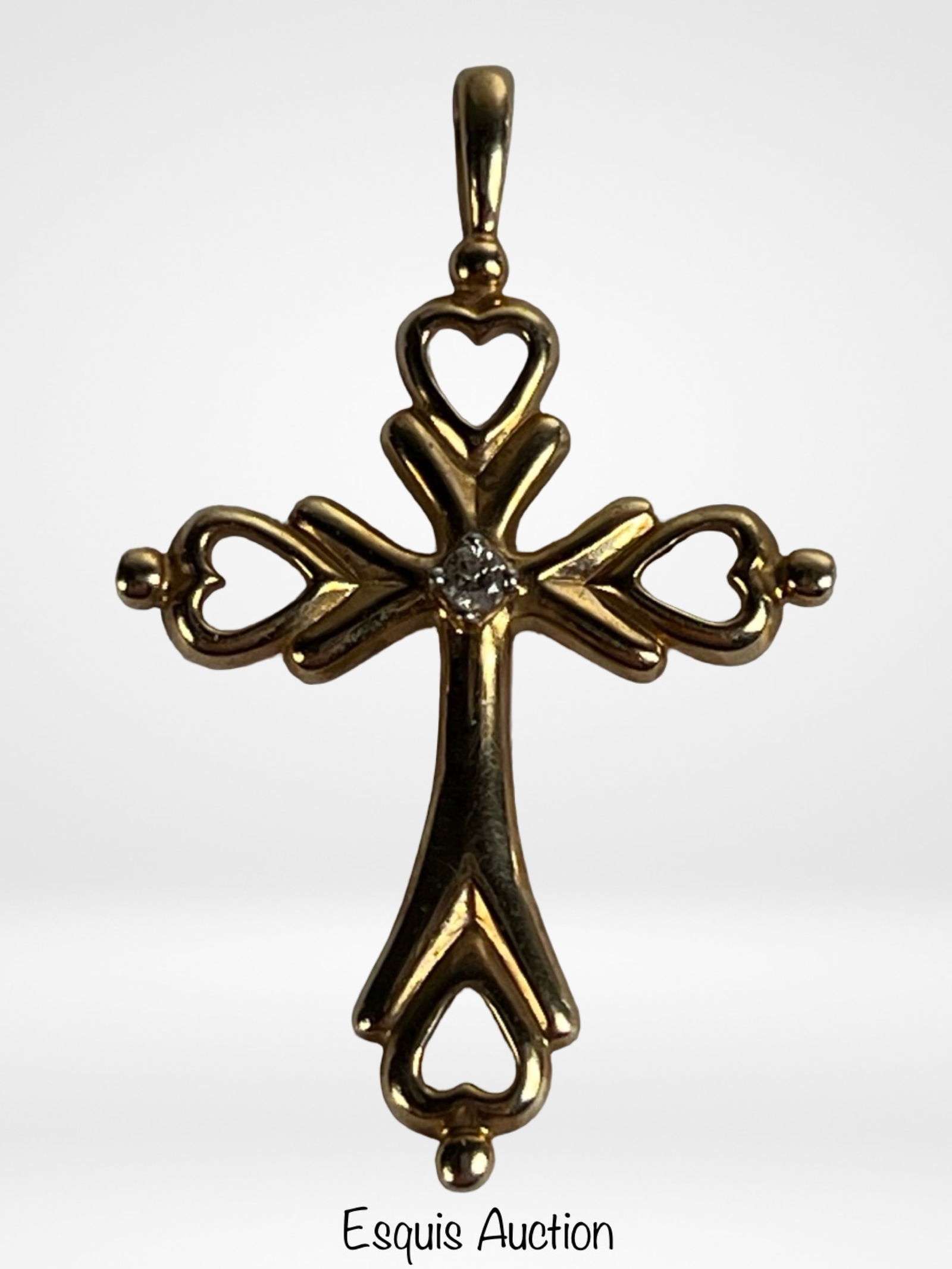 10K Gold Diamond Accent Heart Motif Cross Pendant: Elegant 10K yellow gold cross pendant featuring open heart motifs at each terminal, creating a romantic and symbolic design. The center is set with a small diamond accent, adding a subtle touch of