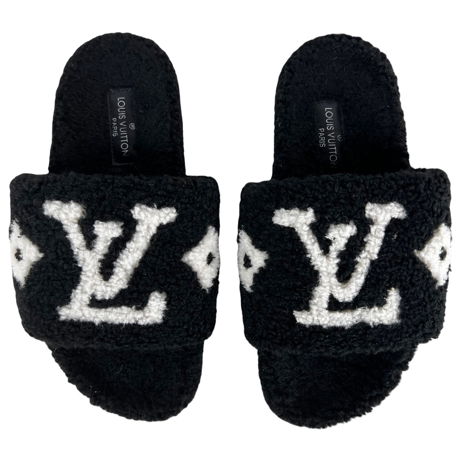 Designer Shearling Monogram Flat Mule Slippers: Luxurious designer flat mule slippers in the popular Bom Dia style, crafted in plush black shearling with contrasting monogram detailing across the wide upper strap. Slip-on silhouette offers