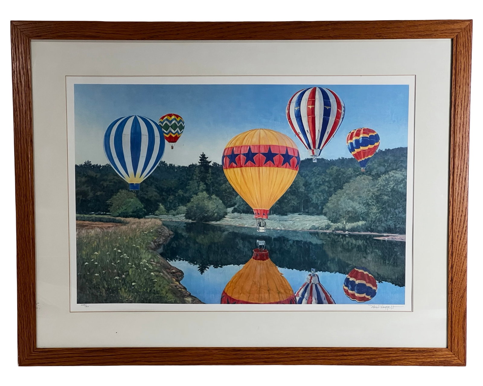 Noel Daggett - Air Balloons LE Signed Lithograph: Color lithograph titled "Air Balloon Show" by listed artist Noel Daggett, depicting a vibrant hot air balloon scene drifting above a tranquil river landscape with mirrored reflections below. The compo