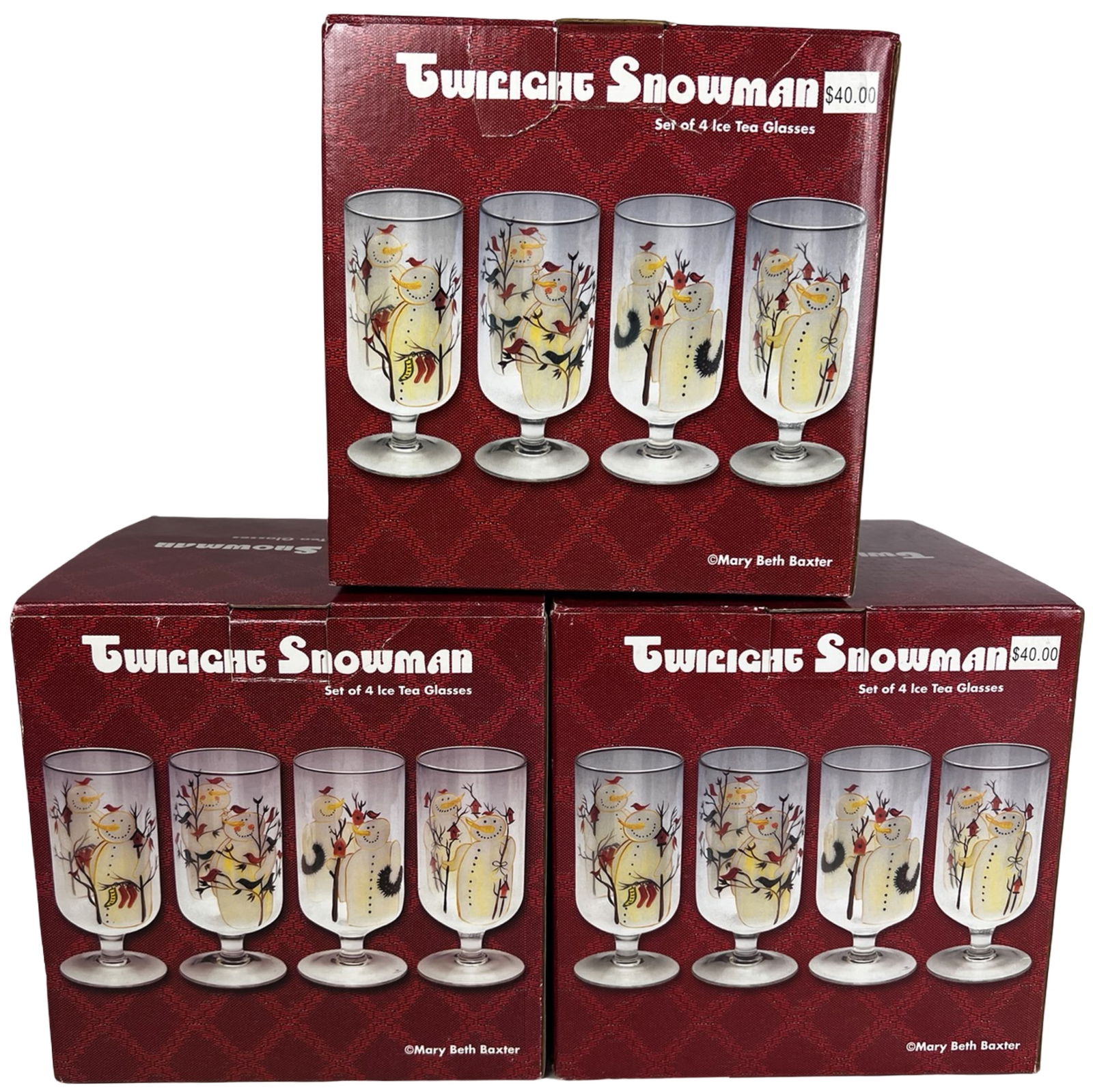 Mary Beth Baxter Twilight Snowman Ice Tea Glasses: Group of three boxed sets of "Twilight Snowman" ice tea glasses featuring charming winter-themed artwork by Mary Beth Baxter. Each set includes four footed glasses decorated with whimsical snowman sce