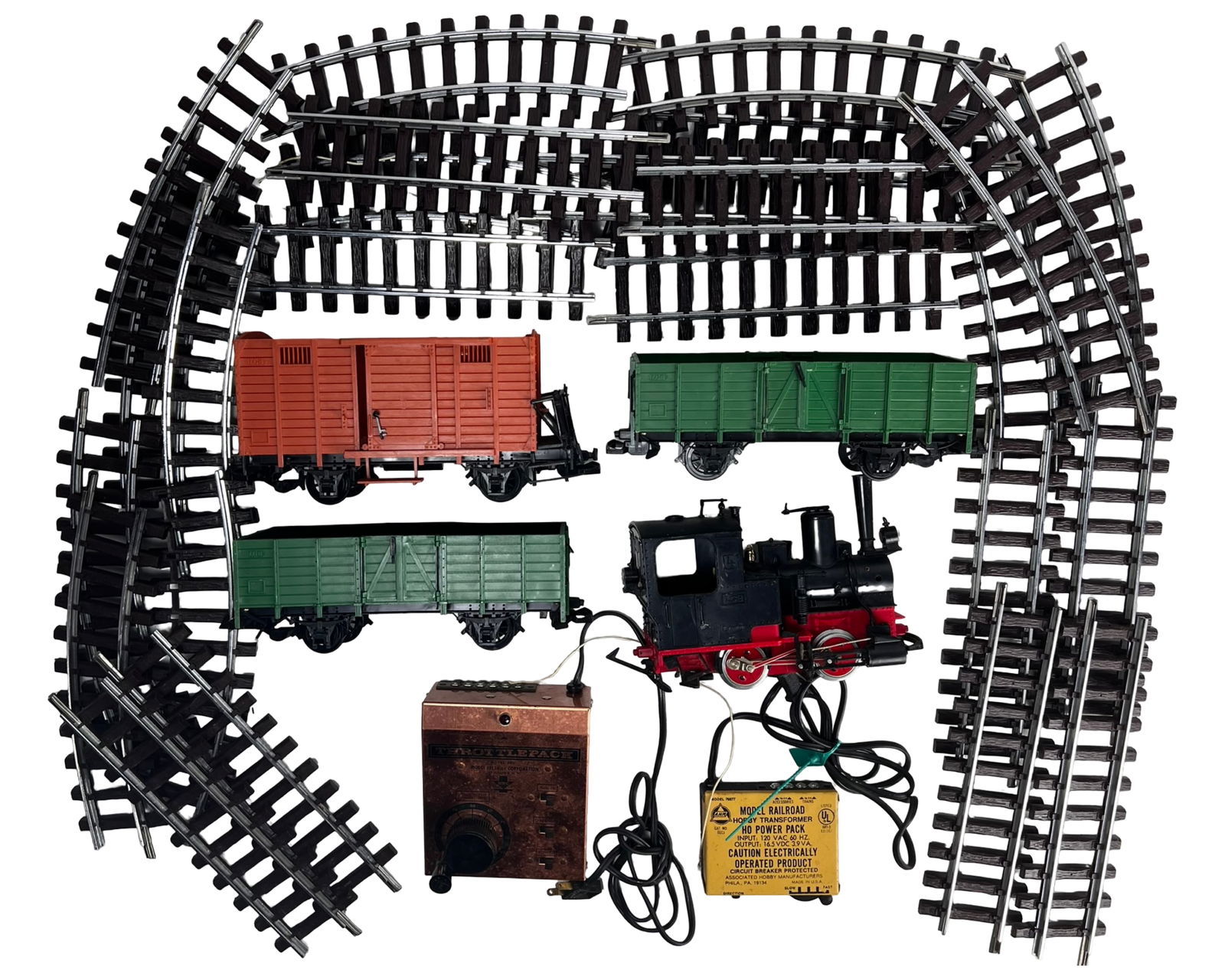 Vintage LGB G Scale Train Se- t Steam Locomotive,: Substantial vintage LGB G scale train set featuring a classic steam locomotive accompanied by three freight cars and an assortment of curved and straight track sections forming a full layout.The lot i