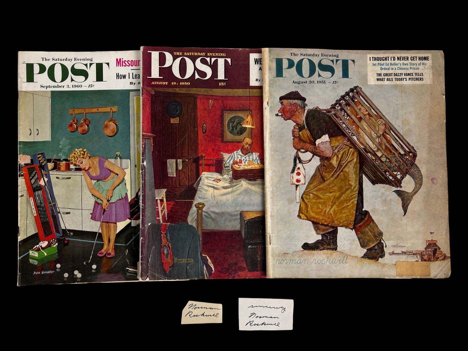 Norman Rockwell- 2 Signature/ Autograph Cuts: Appealing collection featuring two Norman Rockwell signature cuts, accompanied by three vintage issues of The Saturday Evening Post showcasing classic Rockwell cover illustrations. The signatures are