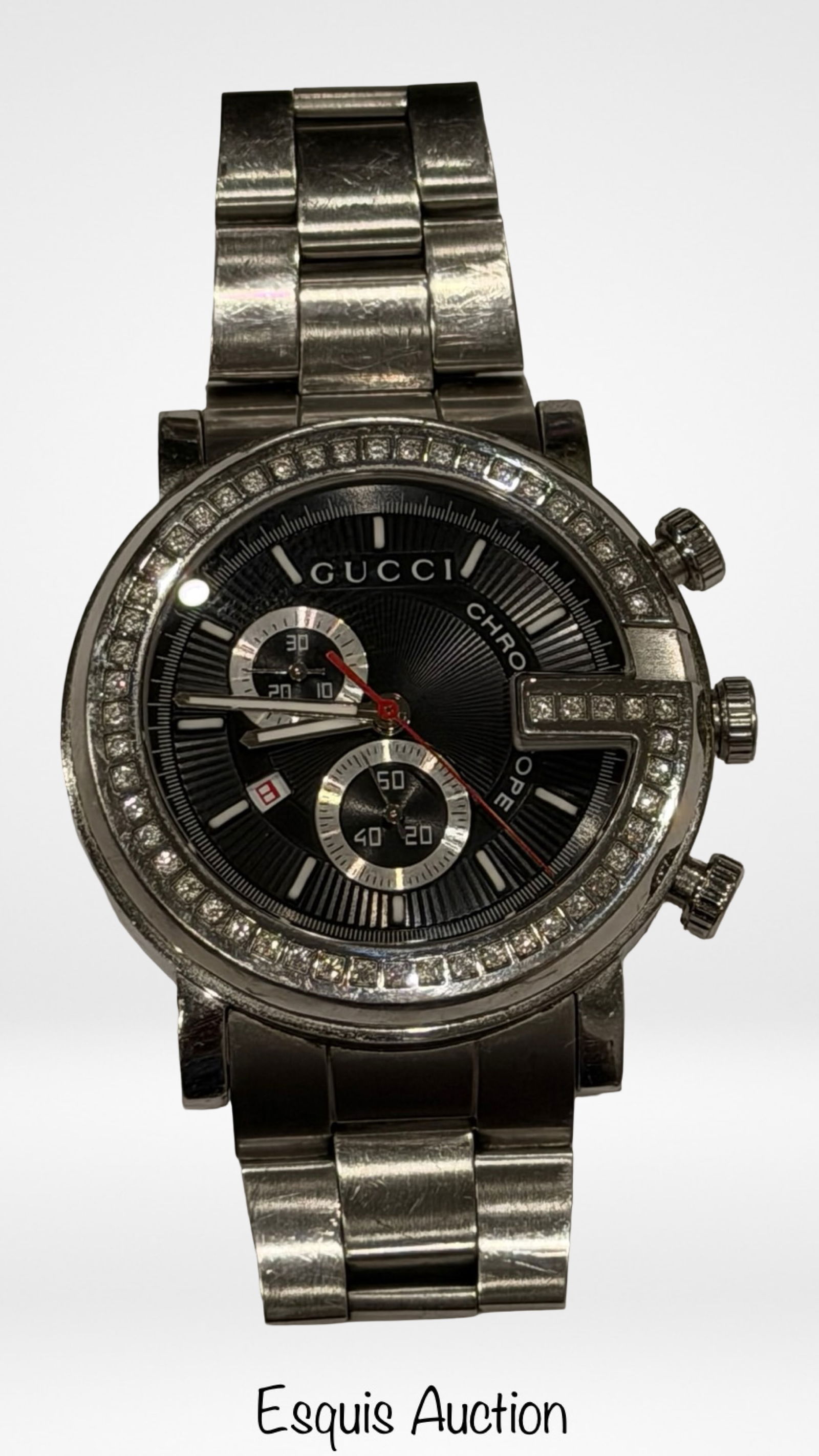 Gucci G-Chrono Diamond Bezel Chronograph Watch: Gucci G-Chrono men's wristwatch crafted in stainless steel and accented with approximately 2.00 carats total weight of diamonds set around the bezel and on the right-side detail. Black dial with chron