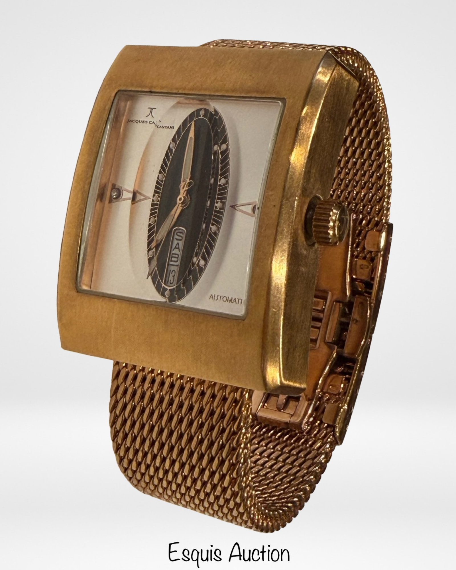 Jacques Cantani JC-940 Jump Hour Automatic Watch: Jacques Cantani wristwatch, model JC-940, featuring a bold curved rectangular case in gold-tone finish with matching mesh bracelet. Unique dial design with central oval display, jump hour