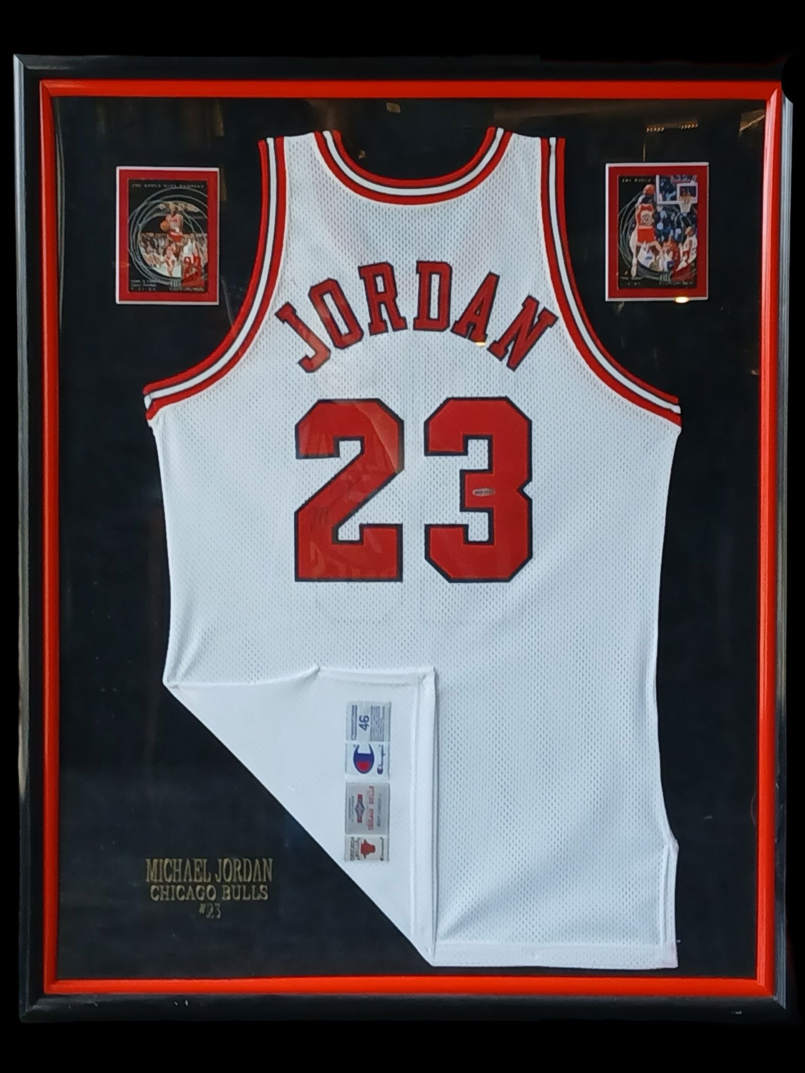Michael Jordan Signed Chicago Bulls #23 Jersey: Professionally framed display featuring an autographed #23 Chicago Bulls jersey signed by basketball legend Michael Jordan. The signature is executed in black marker on the jersey numbering and remain