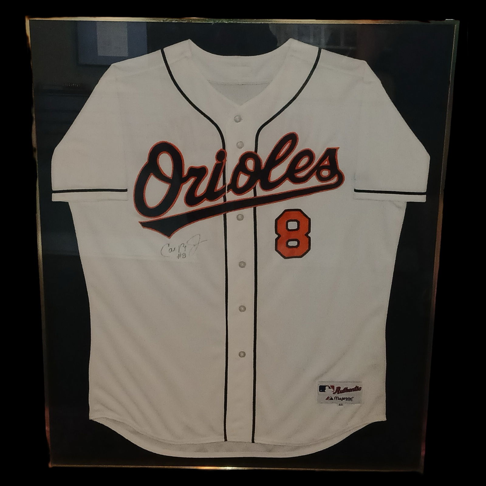 Cal Ripken Jr. Signed Game Worn Orioles Jersey: Game worn Baltimore Orioles home jersey autographed by Cal Ripken Jr., one of baseball's most iconic and durable players. The jersey features his number 8 and classic Orioles script across the front,