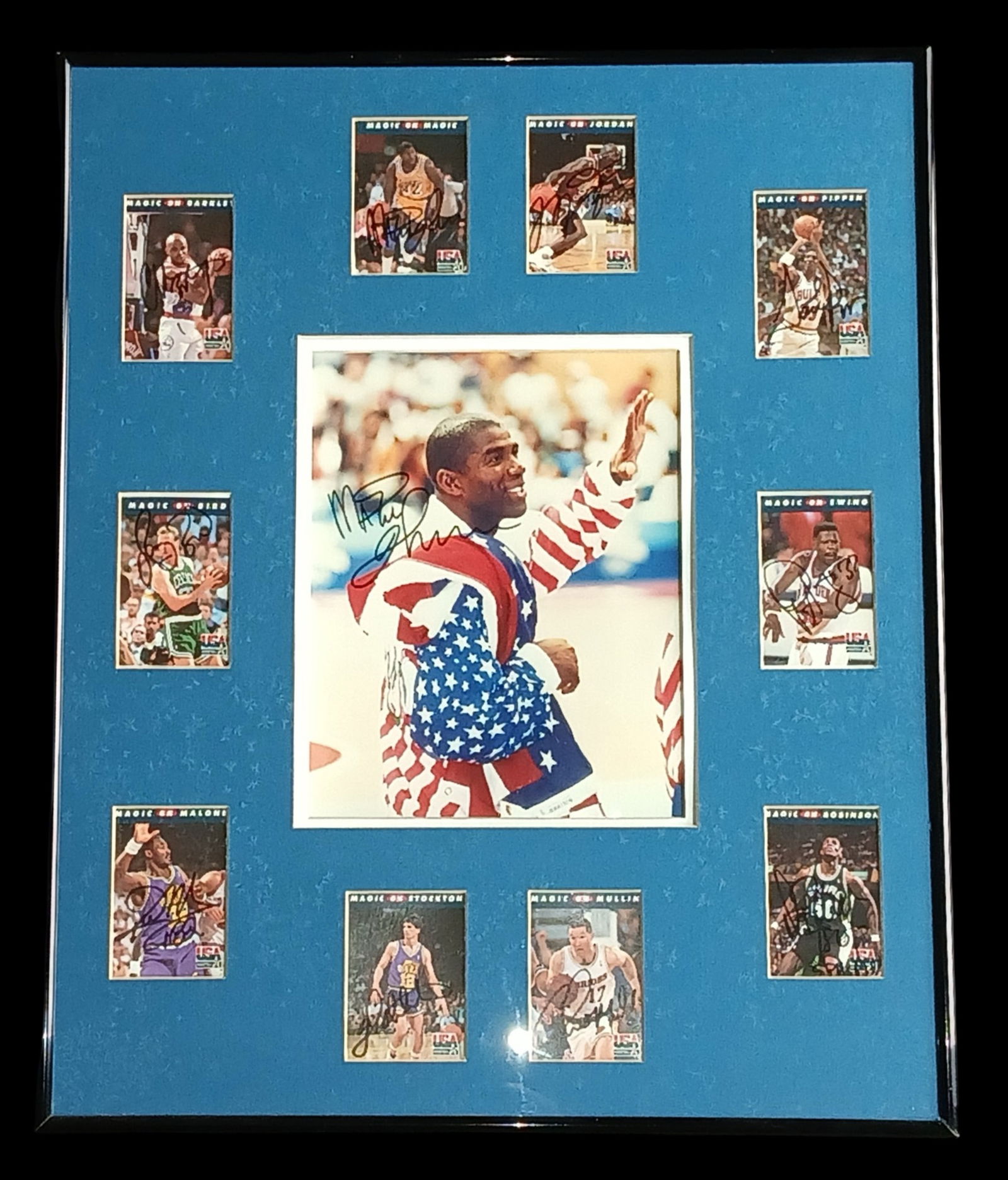 1992 Basketball Dream Team Signed Card Display: Framed collectible display centered around a signed photograph of Magic Johnson from the legendary 1992 Summer Olympics, widely known as the era of the iconic USA "Dream Team." The image captures John