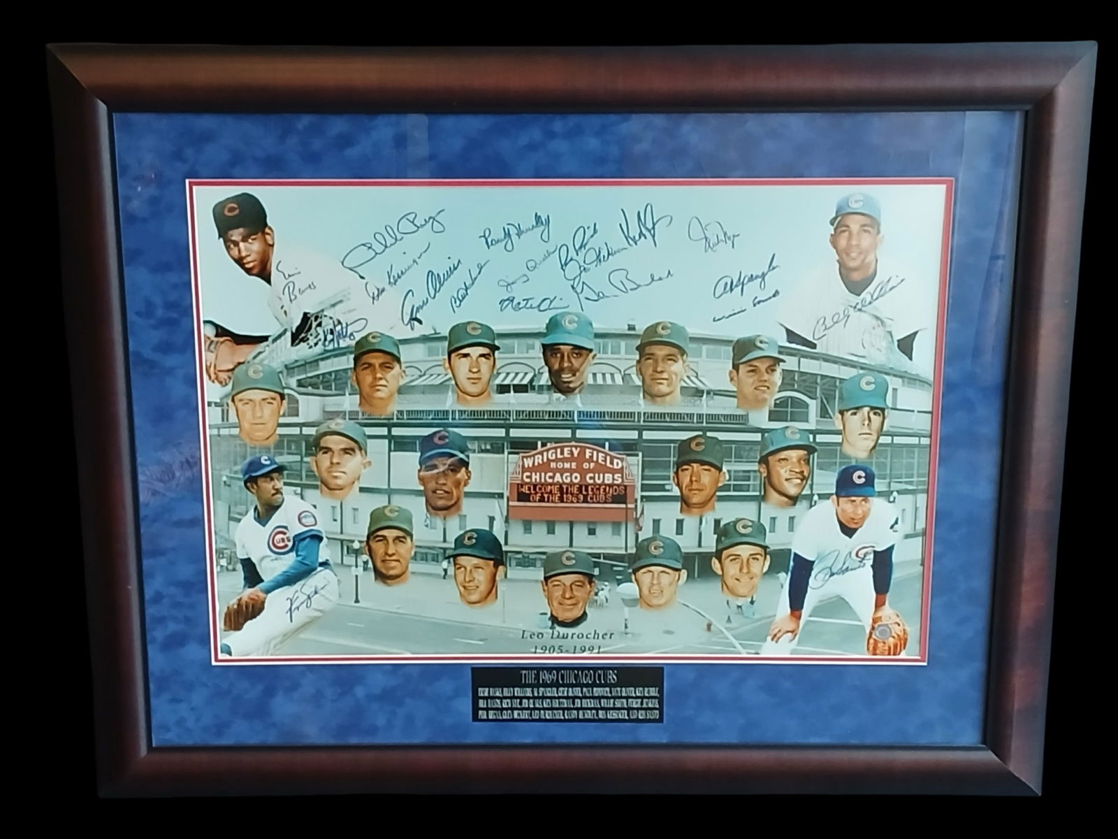 1969 Chicago Cubs Team Multi-Signed Framed Display: Framed commemorative display honoring the legendary 1969 Chicago Cubs, featuring a collage-style presentation of team members over a backdrop of Wrigley Field. The piece is signed by multiple players