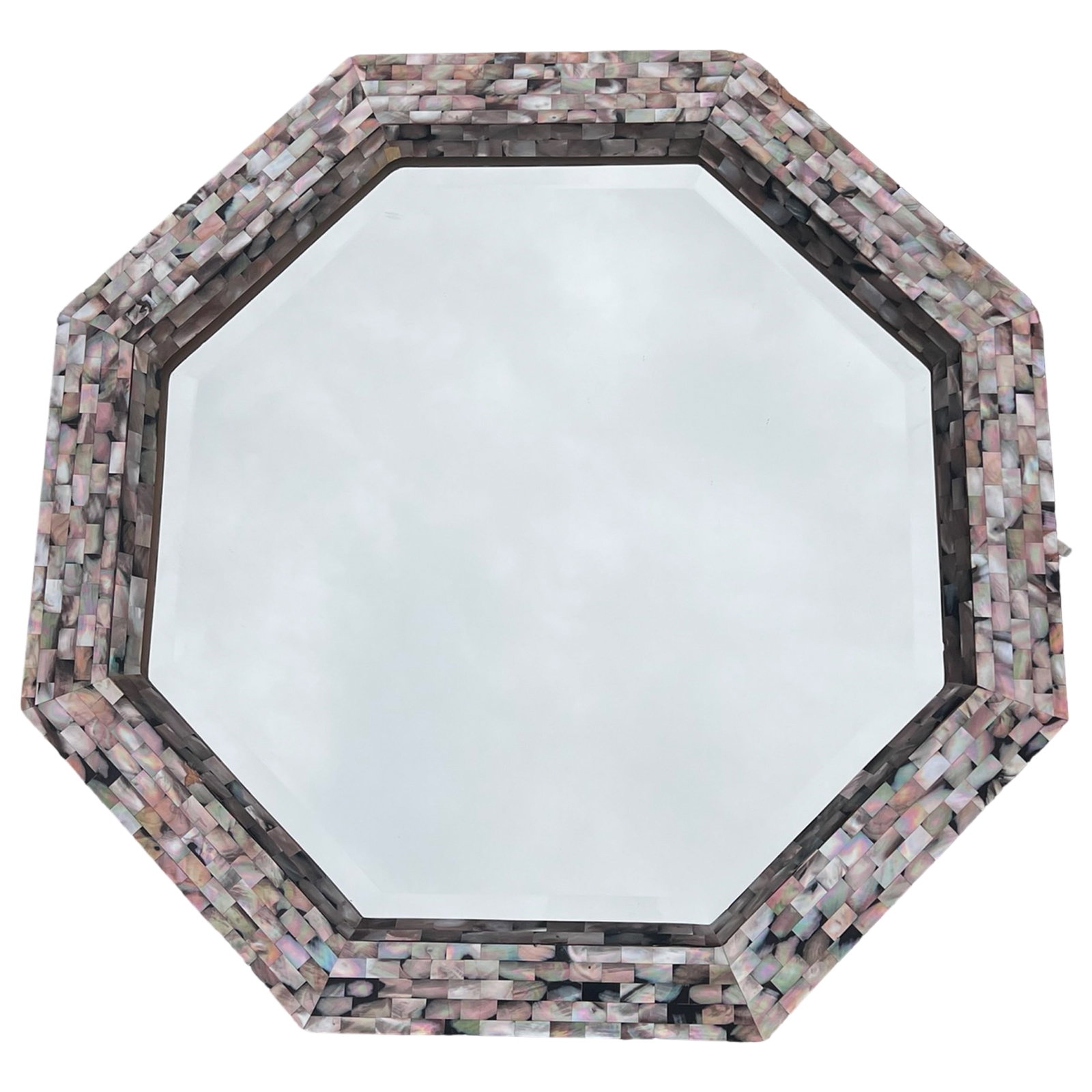 Octagonal Mother of Pearl Mosaic Wall Mirror: Octagonal wall mirror featuring a richly textured frame composed of hand-applied iridescent mother of pearl mosaic tiles. The natural shell pieces display a range of shimmering tones from soft gray an