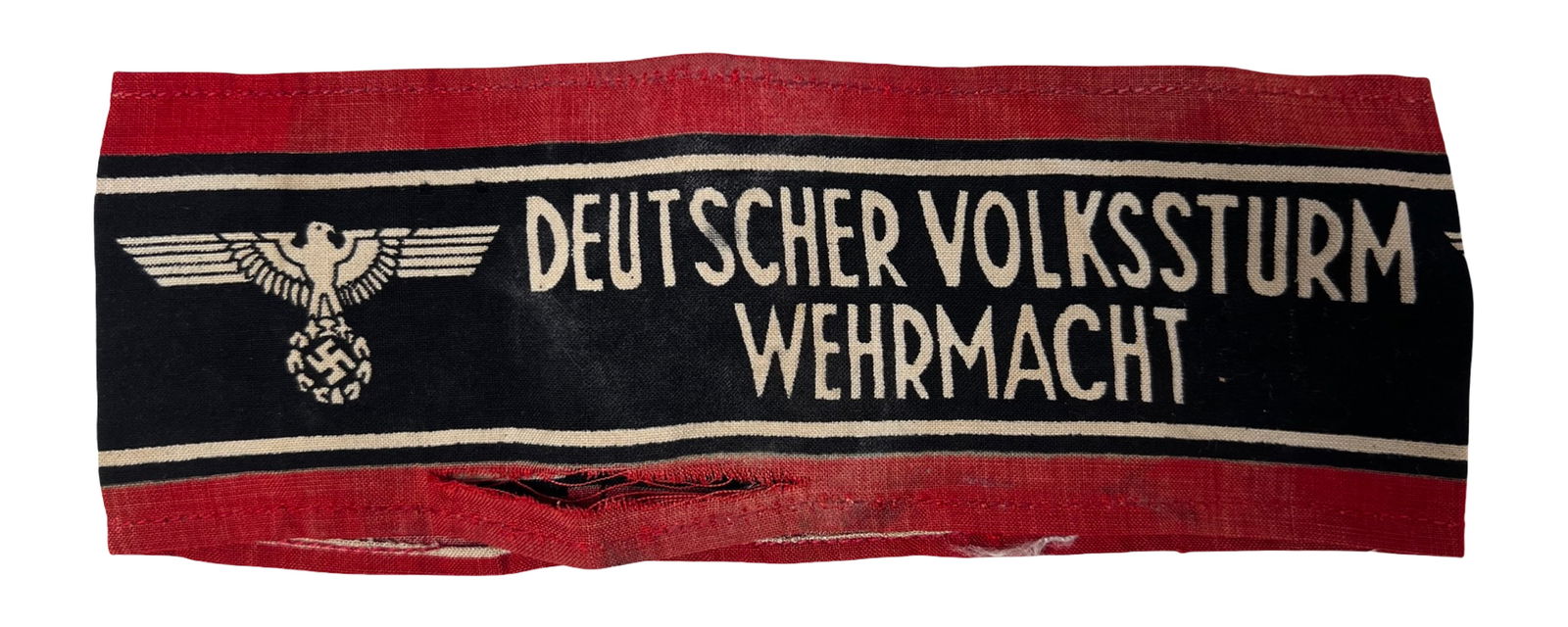 WWII German Volkssturm Wehrmacht Armband: Original World War II-era German Volkssturm armband featuring the printed inscription "Deutscher Volkssturm Wehrmacht" and central eagle insignia. Condition shows evident age and use, including
