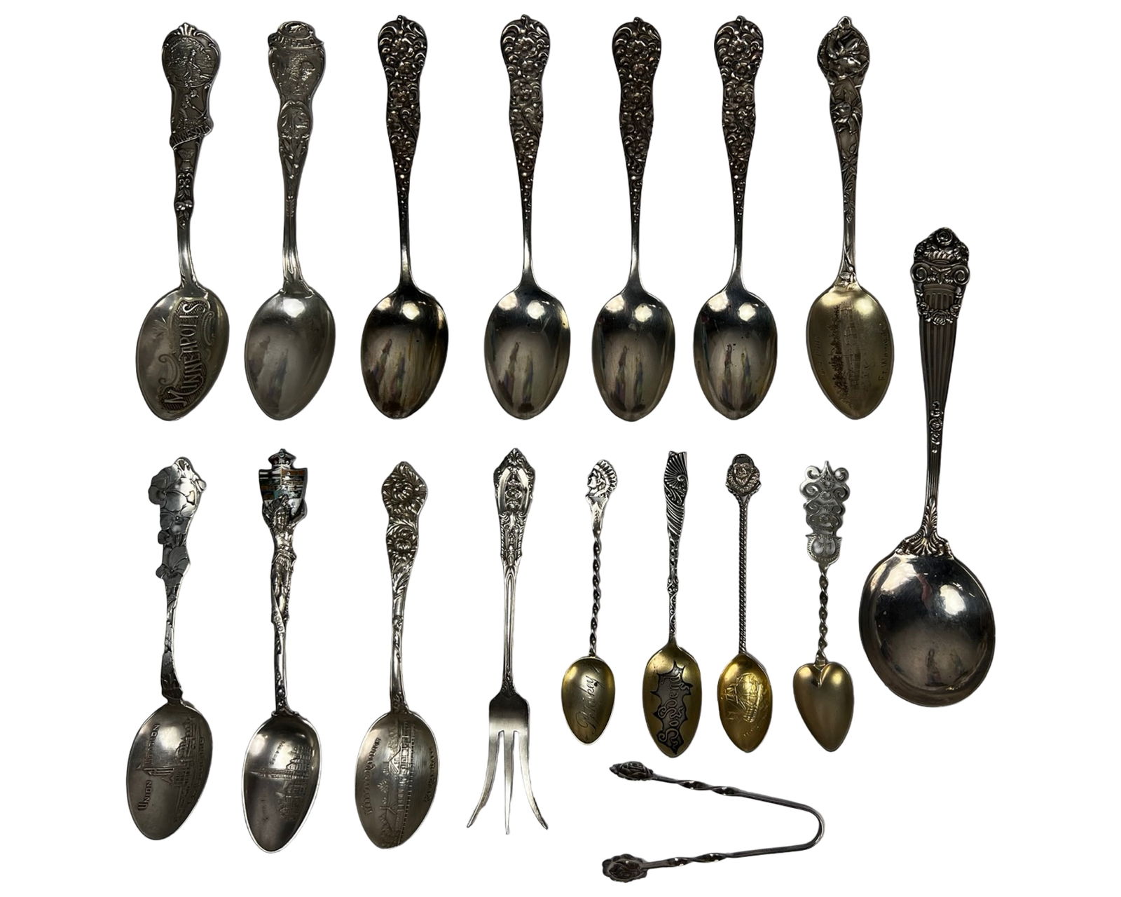 Antique & Vintage Sterling Silver Spoon Collection: Collection of antique and vintage sterling silver souvenir spoons featuring a wide variety of decorative handles, figural motifs, and engraved bowls. Examples include state and city souvenirs such as
