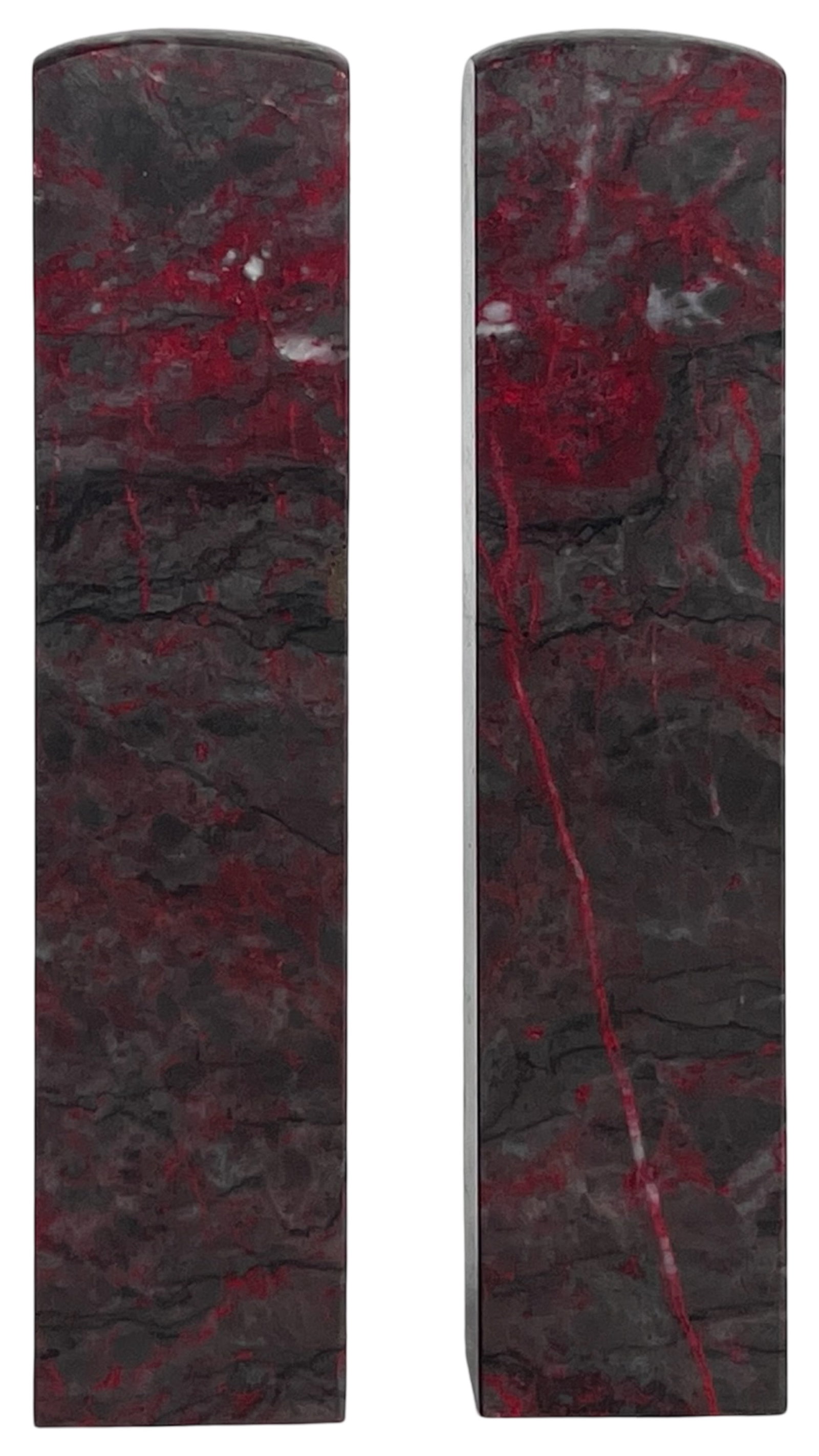 Antique Chinese Jixue Chicken Blood Stone Seals: Pair of antique Chinese carved stone seals crafted from Jixue "chicken blood" stone, known for its dramatic deep red cinnabar-like inclusions against a darker matrix. These traditional scholar's objec