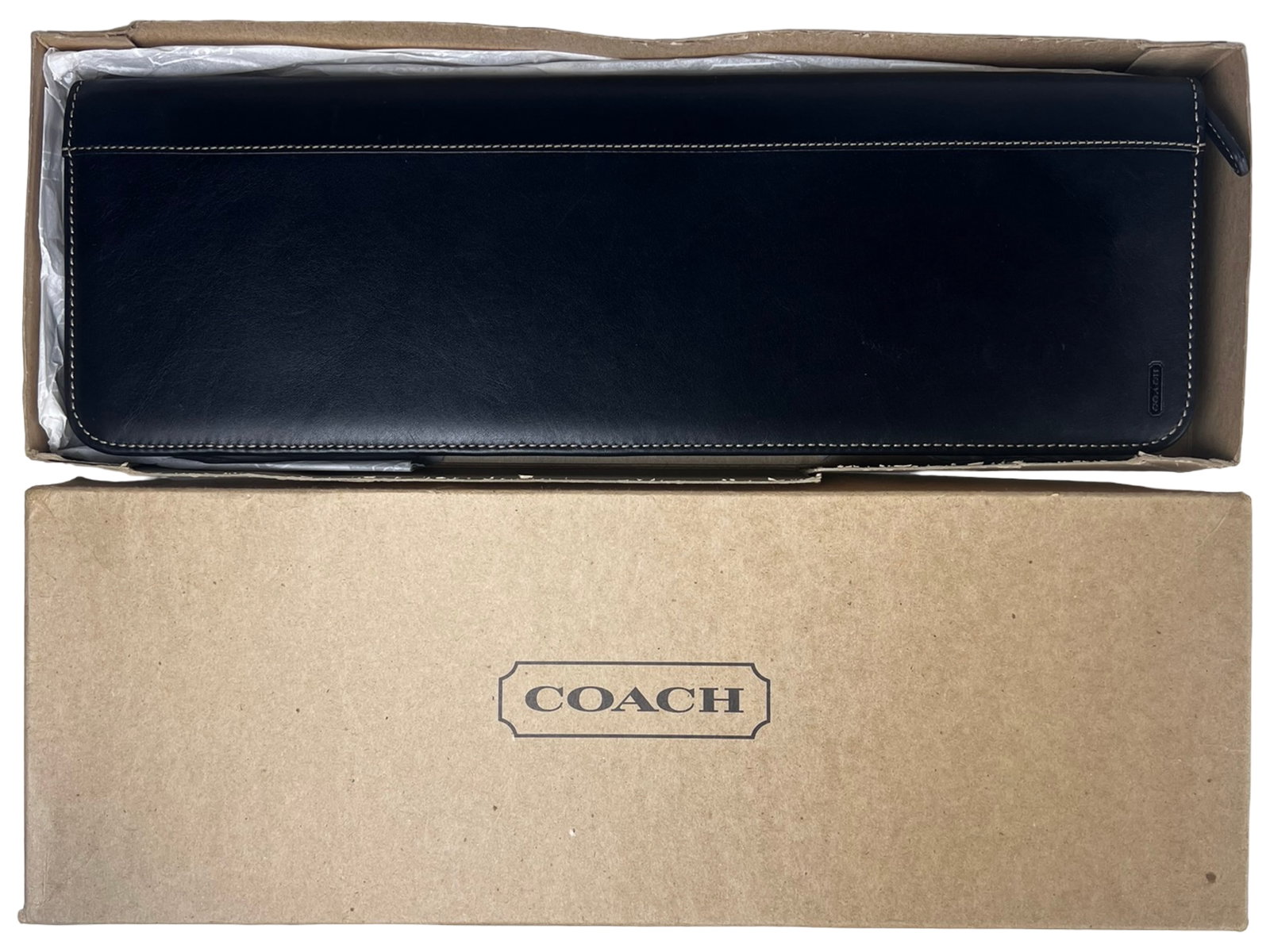 Coach Black Leather Zip Travel Tie Case New in Box: Coach black leather travel tie case featuring a zip-around closure and structured design, ideal for keeping ties neatly stored while traveling. Interior includes secure straps and compartments to hold