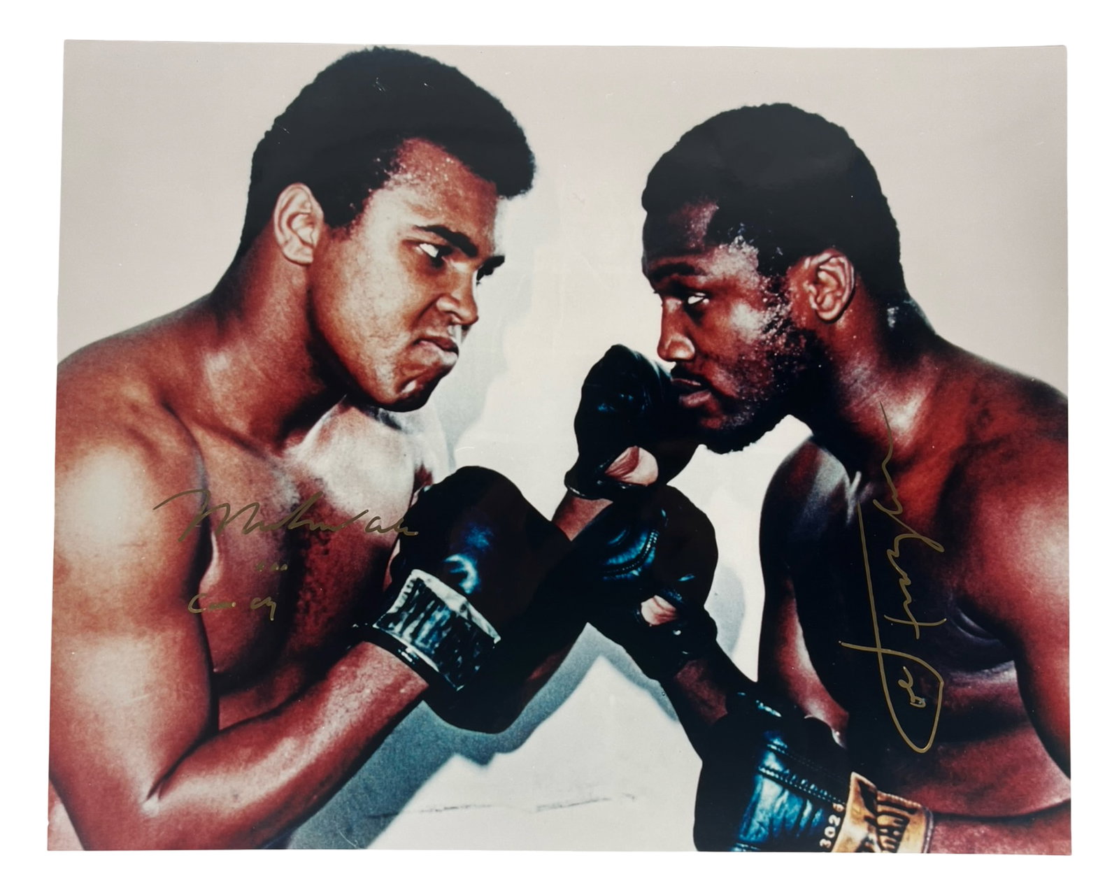 Muhammad Ali & Joe Frazier Signed 16x20 Photo: This remarkable 16" x 20" photograph features the iconic match between Muhammad Ali (formerly known as Cassius Clay) and Joe Frazier, two of the greatest boxers of all time. Both legends have boldly s