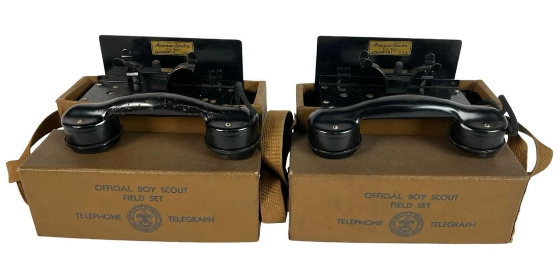 1930s Boy Scout Field Telephone & Telegraph Sets: Pair of original 1930s Official Boy Scout Field Telephone and Telegraph Sets, each housed in its marked tan case with shoulder strap and equipped with its American Electric Co. handset and internal si