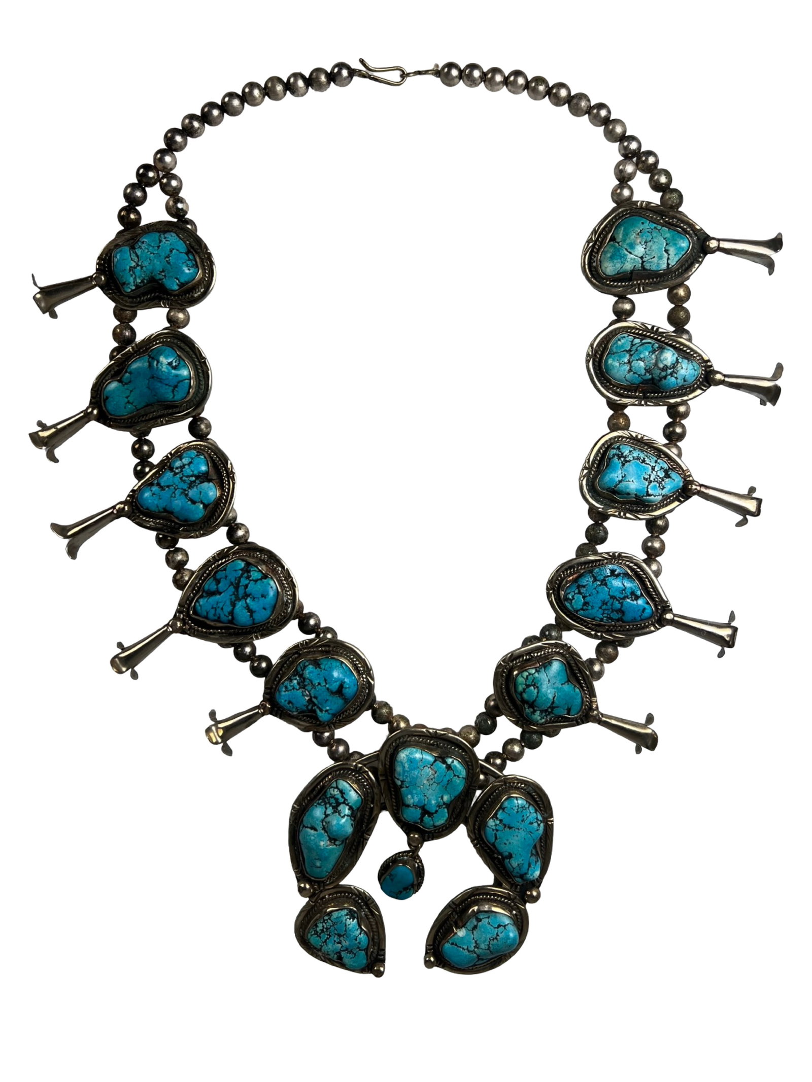 Vintage Native American Squash Blossom Necklace: Striking vintage Native American squash blossom necklace featuring a bold, substantial form with eye-catching stone settings arranged along a double-strand beaded design. Each blossom is accented