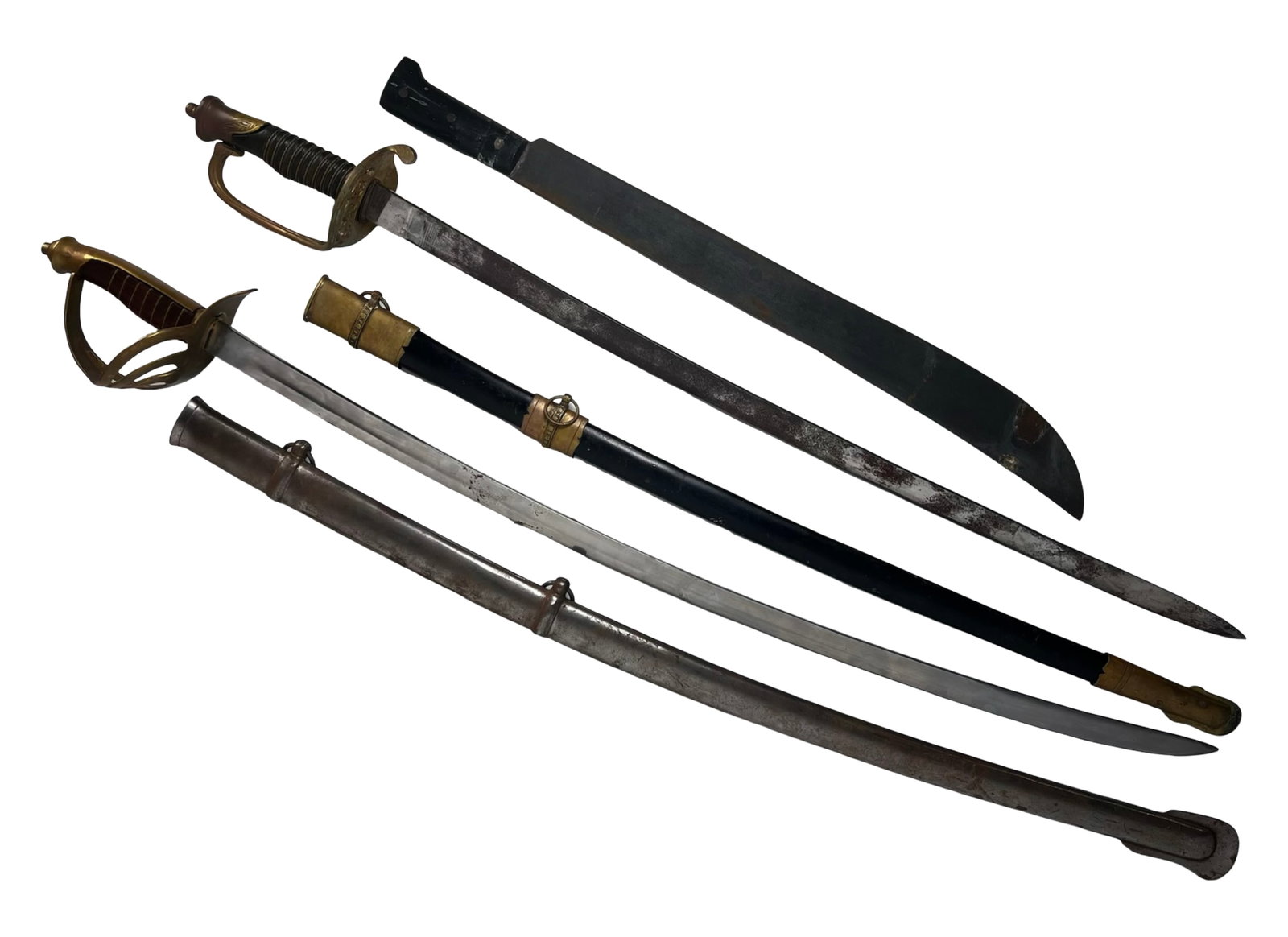 Three-Piece Blade Lot Machete & Two Saber Swords: Mixed three-piece blade lot including a heavy machete and two saber-style swords. The machete features a broad curved blade with a simple handle, showing use and surface wear. One sword has a brass