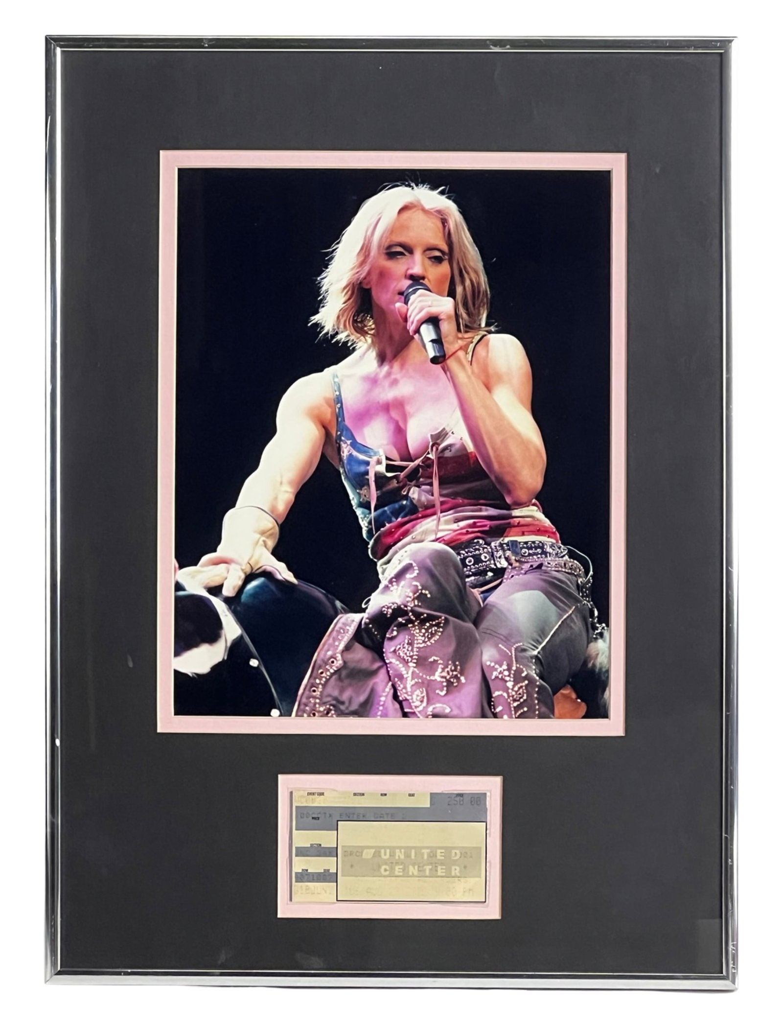 Madonna Framed Concert Photo / Ticket Stub Display: Striking framed concert memorabilia display featuring Madonna during her iconic Drowned World Tour (2001). The piece showcases a vivid live performance photograph capturing Madonna on stage, paired
