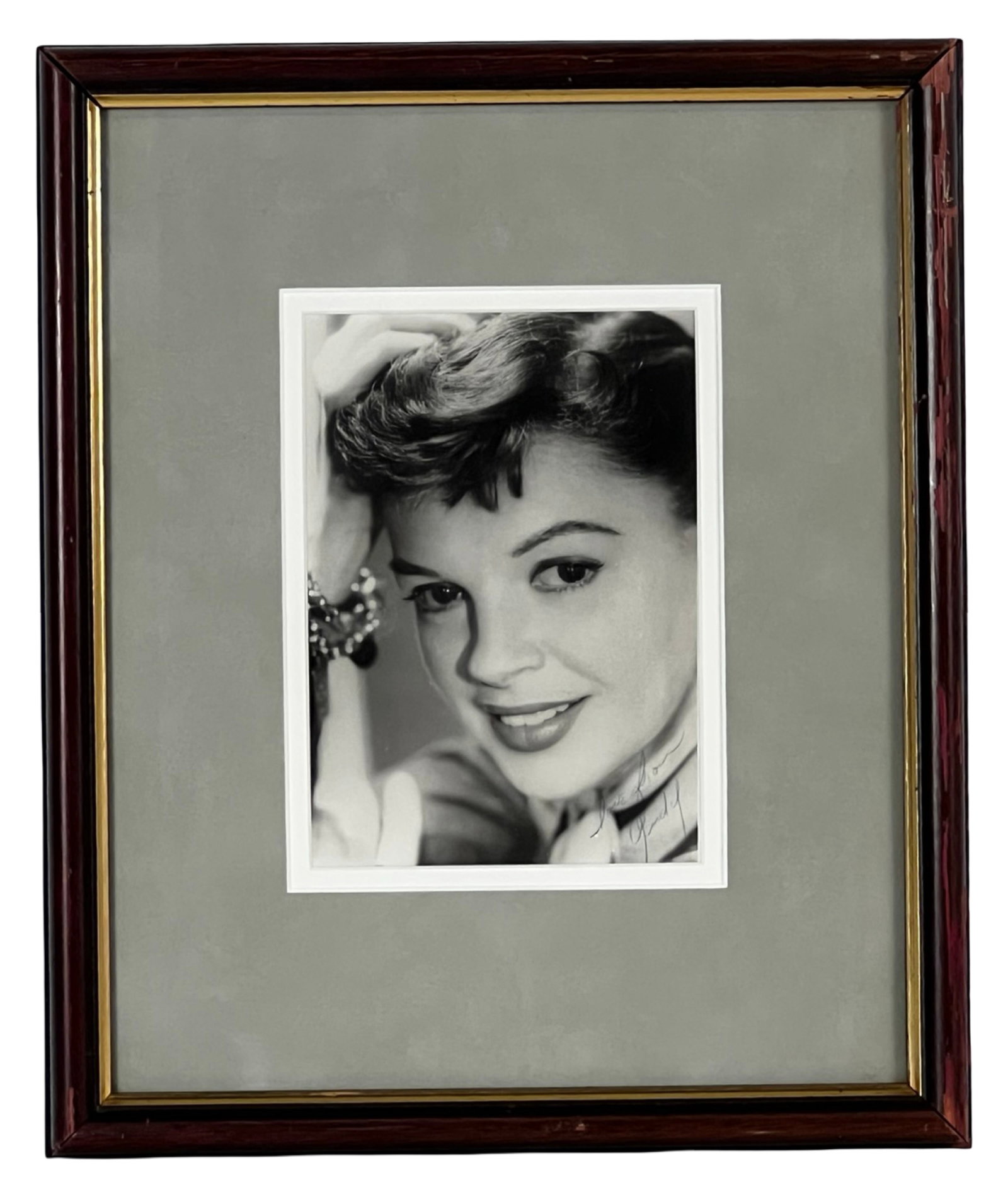 Judy Garland Autographed Photograph "Vicki Lester": Autographed black-and-white photograph of Judy Garland in her role as Vicki Lester from the 1954 film A Star Is Born. The image captures Garland in a classic studio portrait, with her signature appear