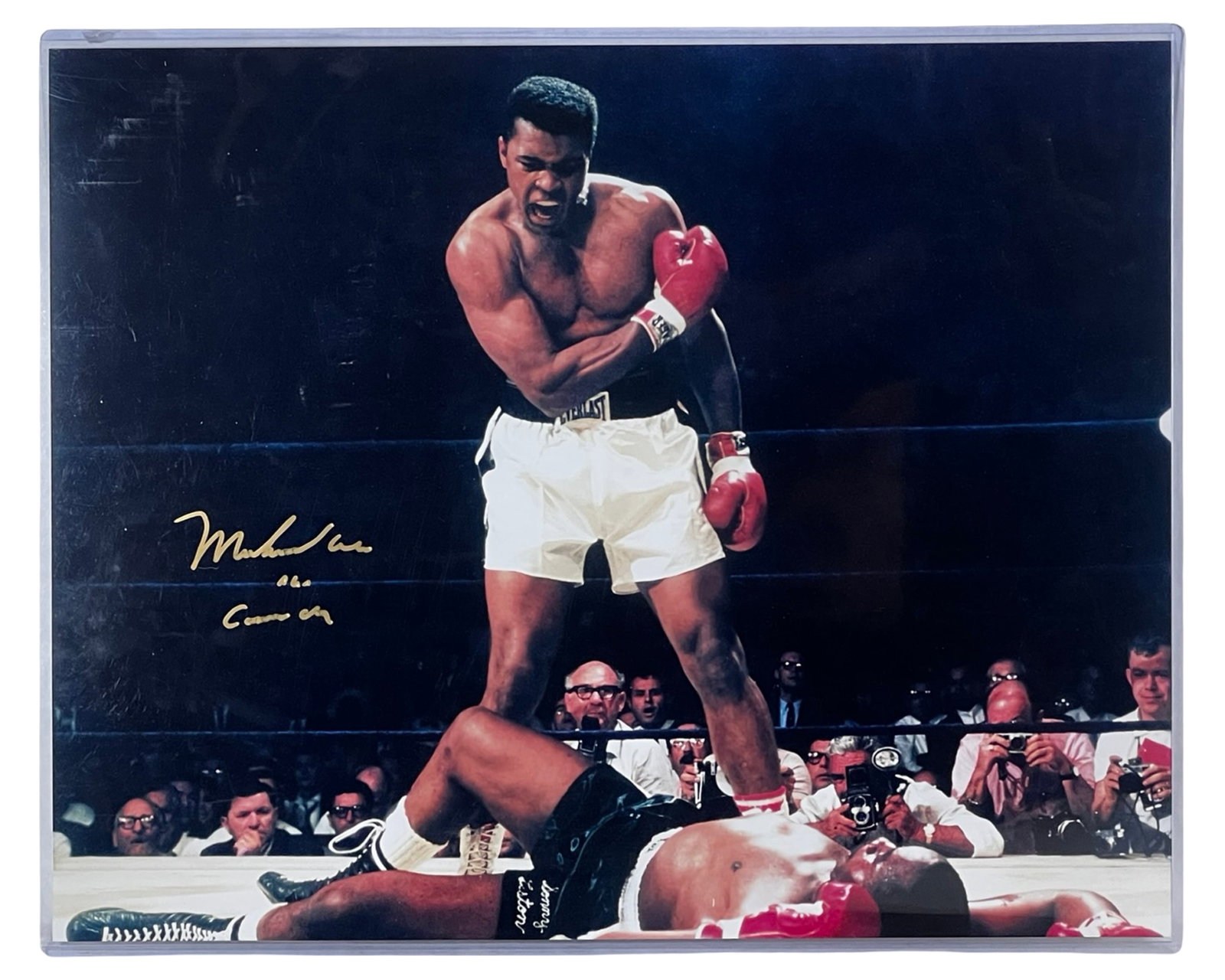 Muhammad Ali Autographed Action Photograph: Powerful signed action photograph capturing Muhammad Ali moments after dropping Sonny Liston during their heavyweight championship rematch on May 25, 1965. Frequently cited as one of the most iconic i
