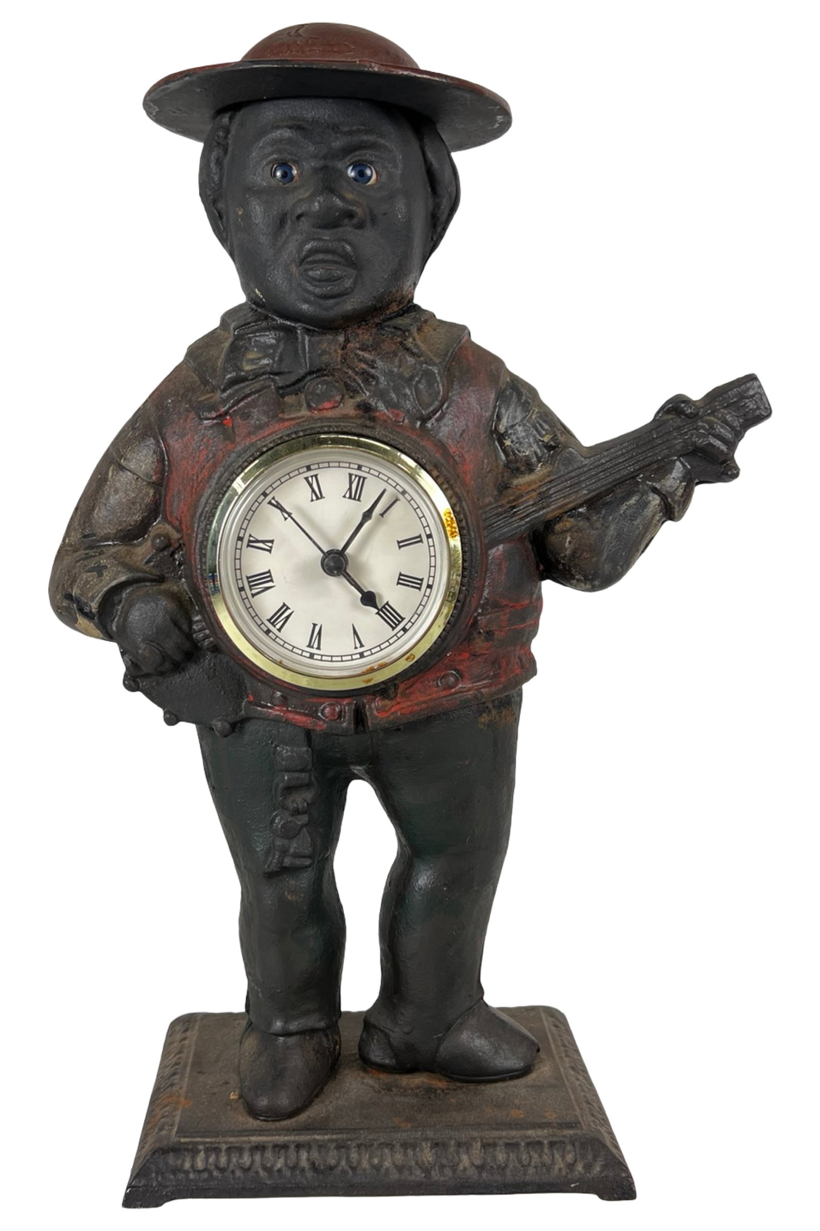 Bradley & Hubbard Cast Iron Blinking Eye Clock: Antique cast iron figural clock bank by Bradley & Hubbard, dating to the late 19th century. This iconic form depicts a standing banjo player with expressive glass "blinking" eyes, characteristic of th