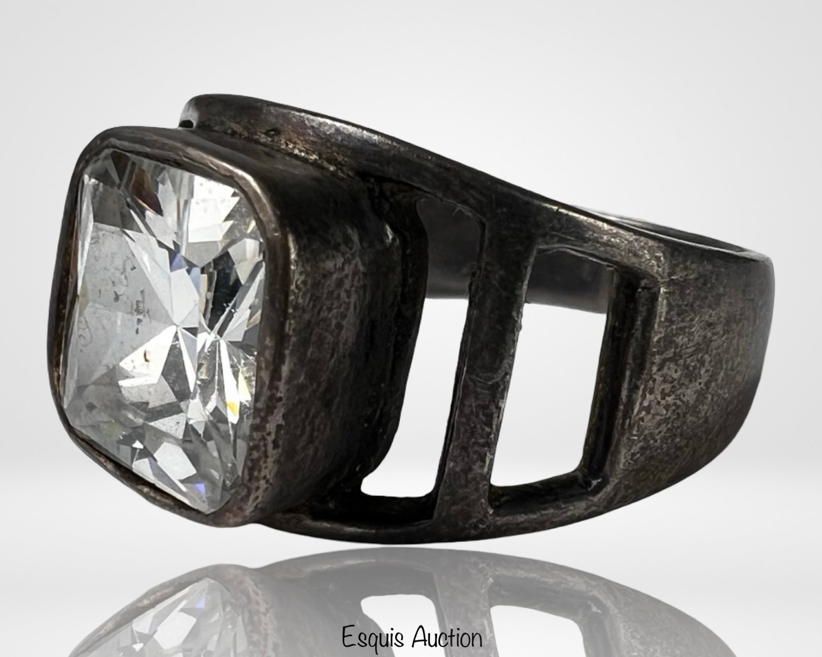 Sterling Silver Men's Ring - Large Faceted Crystal: Striking men's ring crafted in sterling silver and set with a large rectangular faceted crystal that delivers bold brilliance and presence. The ring features a modern openwork design along the shoulde