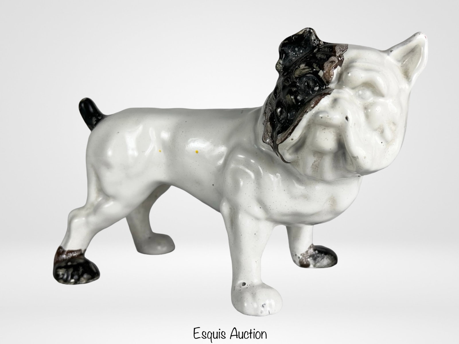 Antique Cast Iron Bulldog Doorstop Sculpture: Charming antique cast iron bulldog doorstop featuring a classic standing form with expressive facial detail and original painted surface. The figure displays a white body with contrasting black