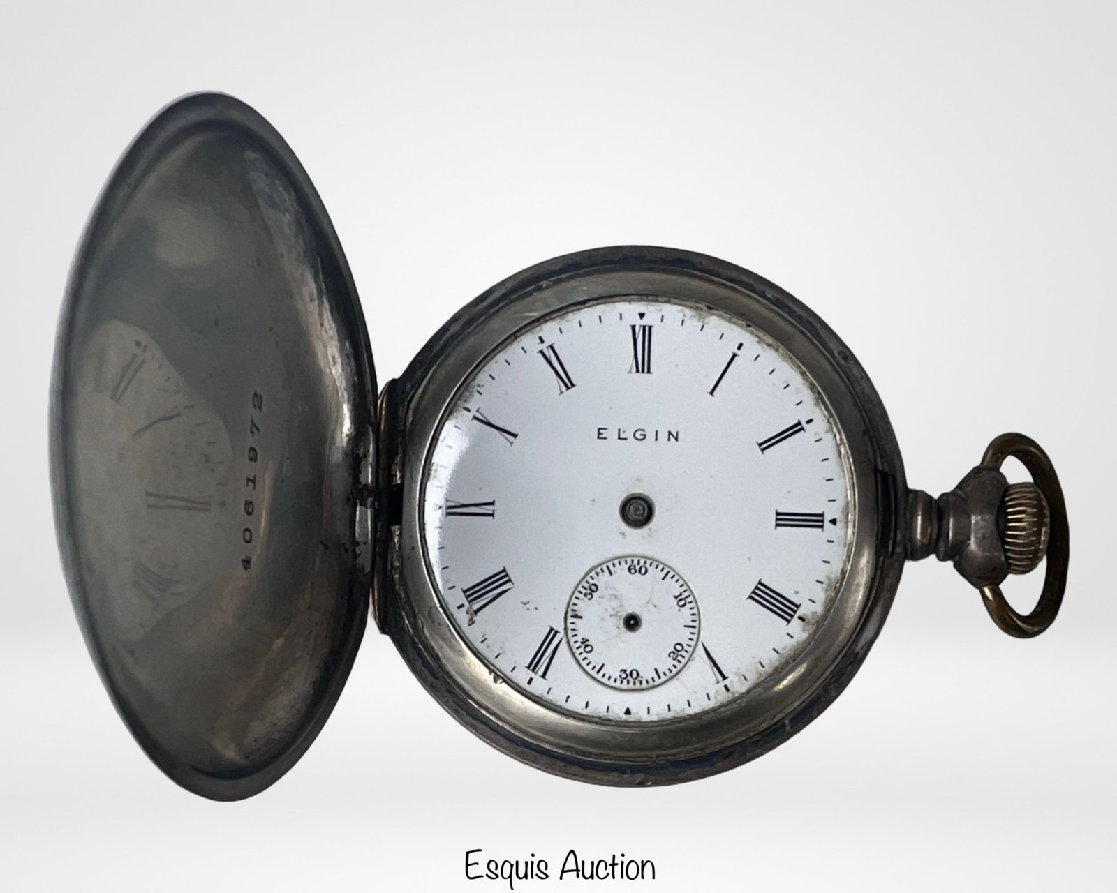 Antique Elgin 15 Jewels Pocket Watch in Sterling: Antique Elgin 15 Jewels Pocket Watch in Sterling Silver Case. As found condition with no hands, no glass.