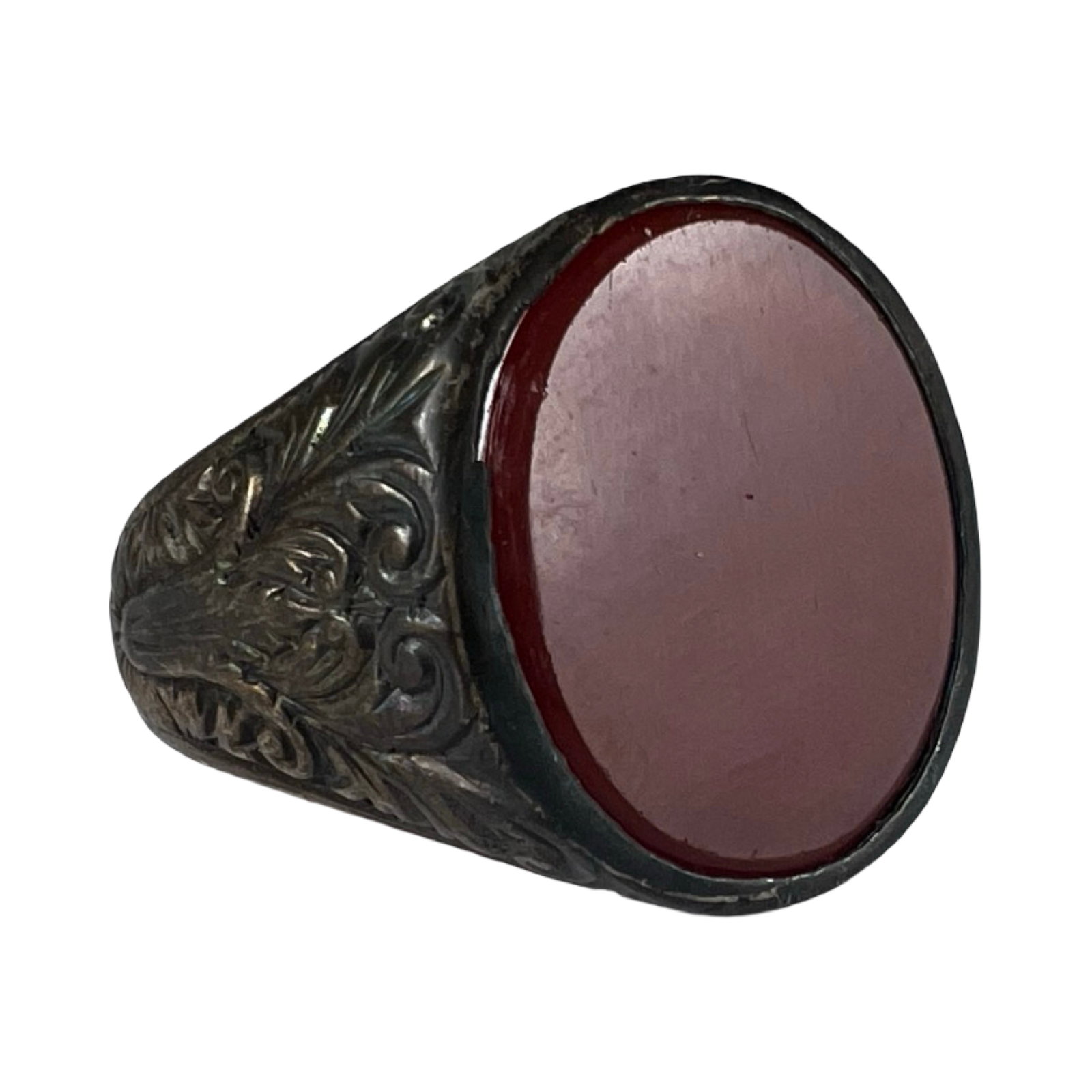 Vintage Sterling Silver Dyed Red Agate Signet Ring: Vintage sterling silver signet-style ring set with an oval cabochon dyed red agate stone. The ring features an engraved decorative mount with classic scrollwork details and a bold, smooth polished sto