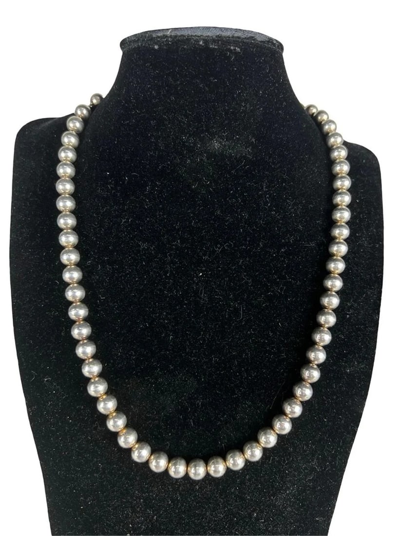 Massive Sterling Silver Bead Necklace: Bold and substantial sterling silver bead necklace featuring a classic graduated ball design with smooth, highly polished spherical beads. The necklace presents a strong visual presence, with larger