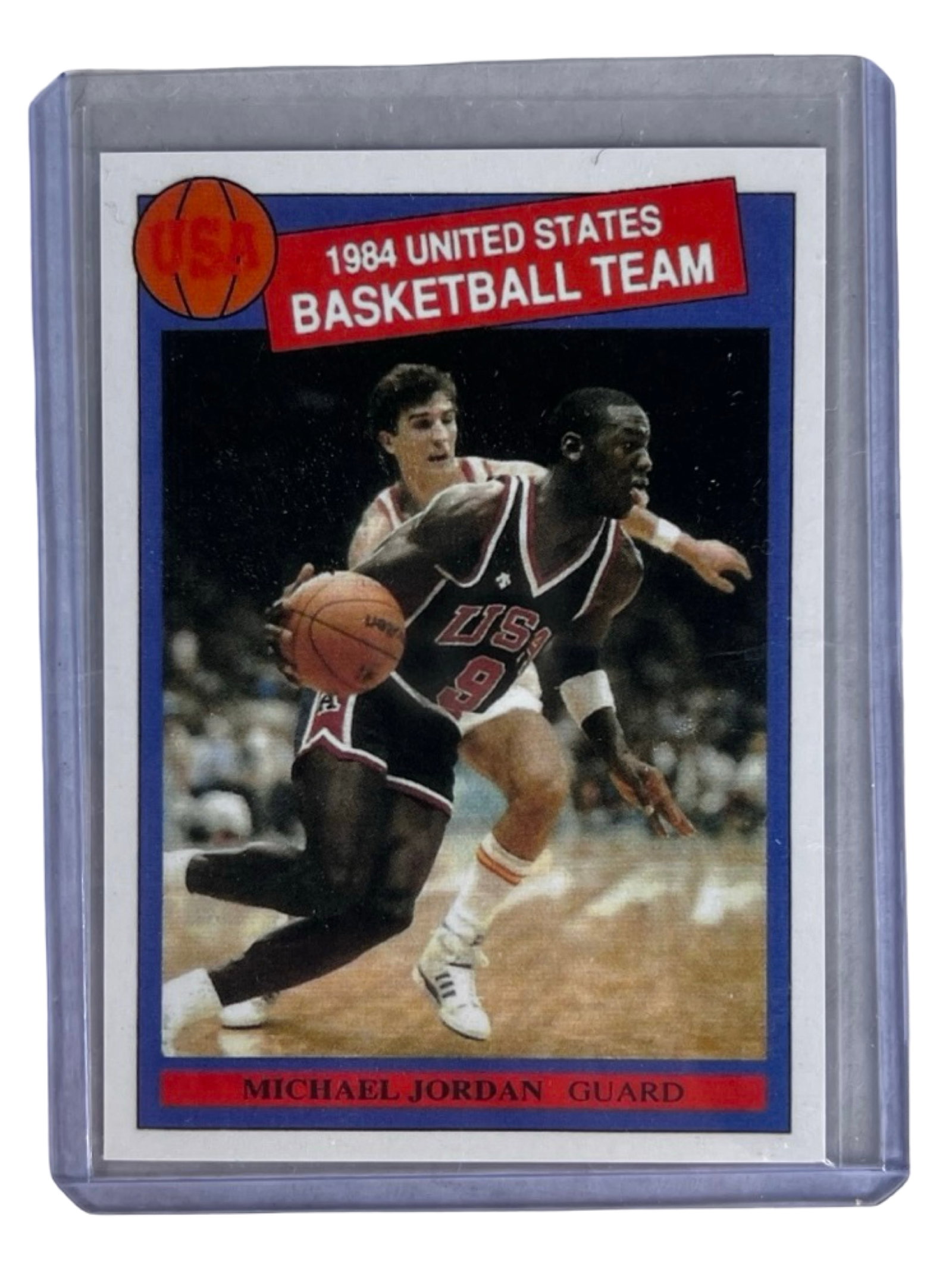 Michael Jordan 1984 Olympic Basketball Rookie Card: Michael Jordan 1984 United States Basketball Team rookie card featuring the NBA superstar in his iconic USA uniform prior to his legendary Chicago Bulls career. Card showcases Jordan during the 1984 O